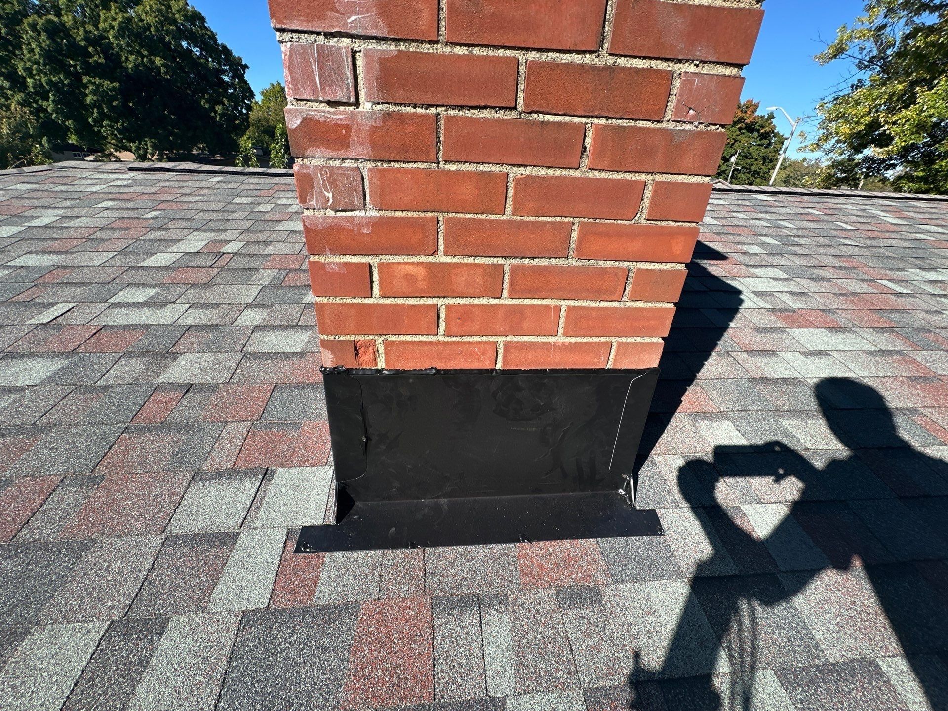 New flashing across the front of the brick chimney, Kettering, Ohio.