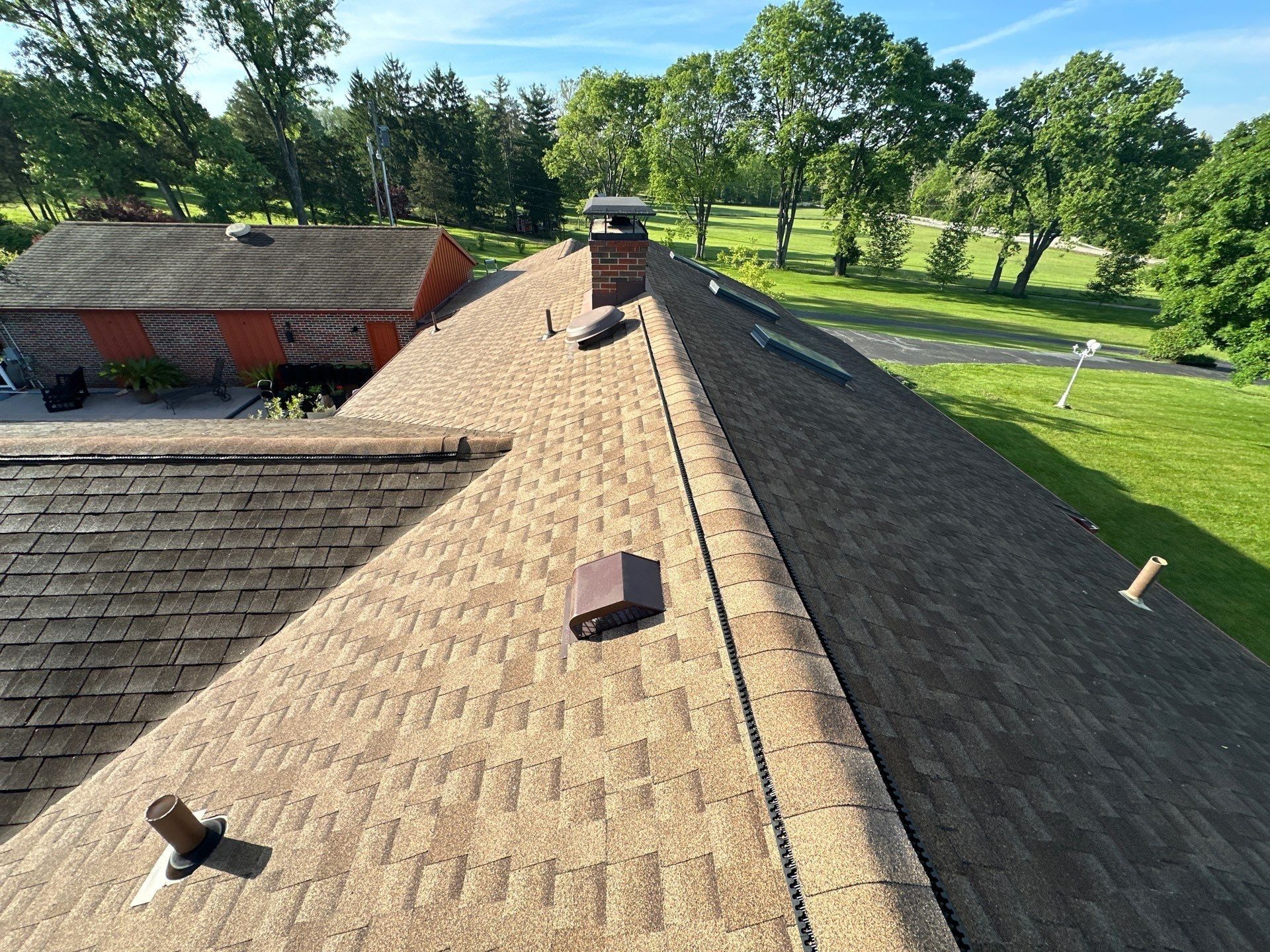 New shingles, vents and a pipe boot on the repaired back slope, Clayton, Ohio.