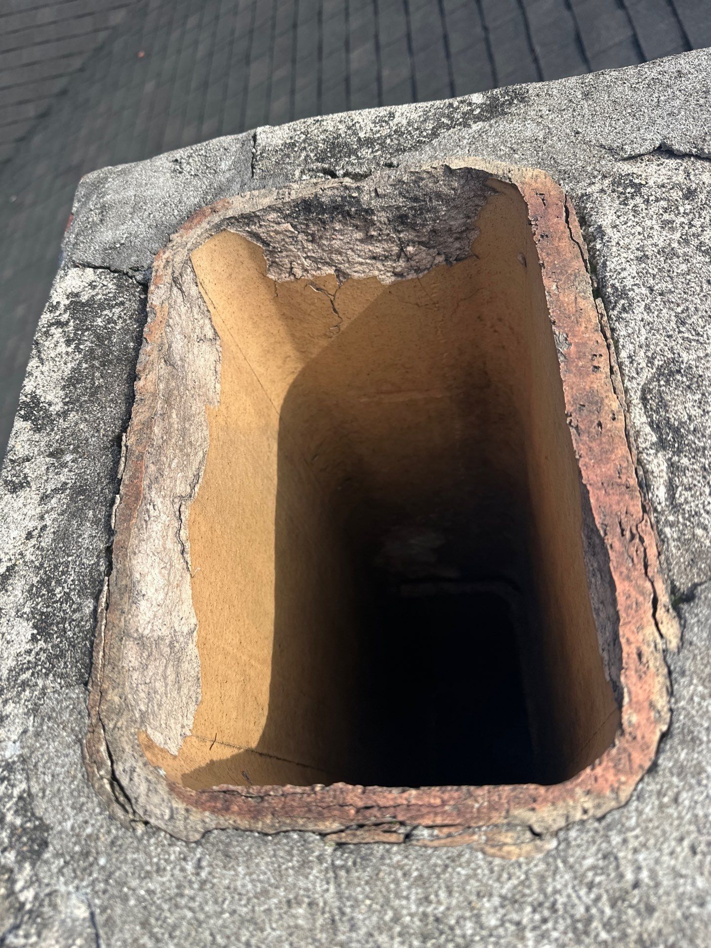 Open clay flue liner at the chimney