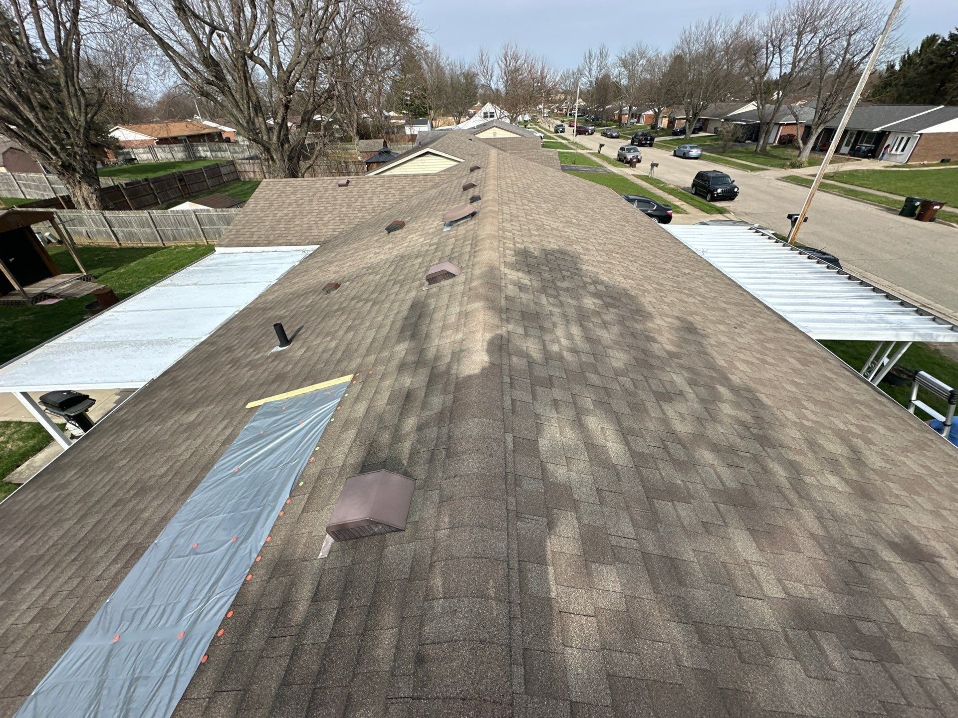 The tarped roof and the porch awnings seen from the ridge, Xenia, Ohio.