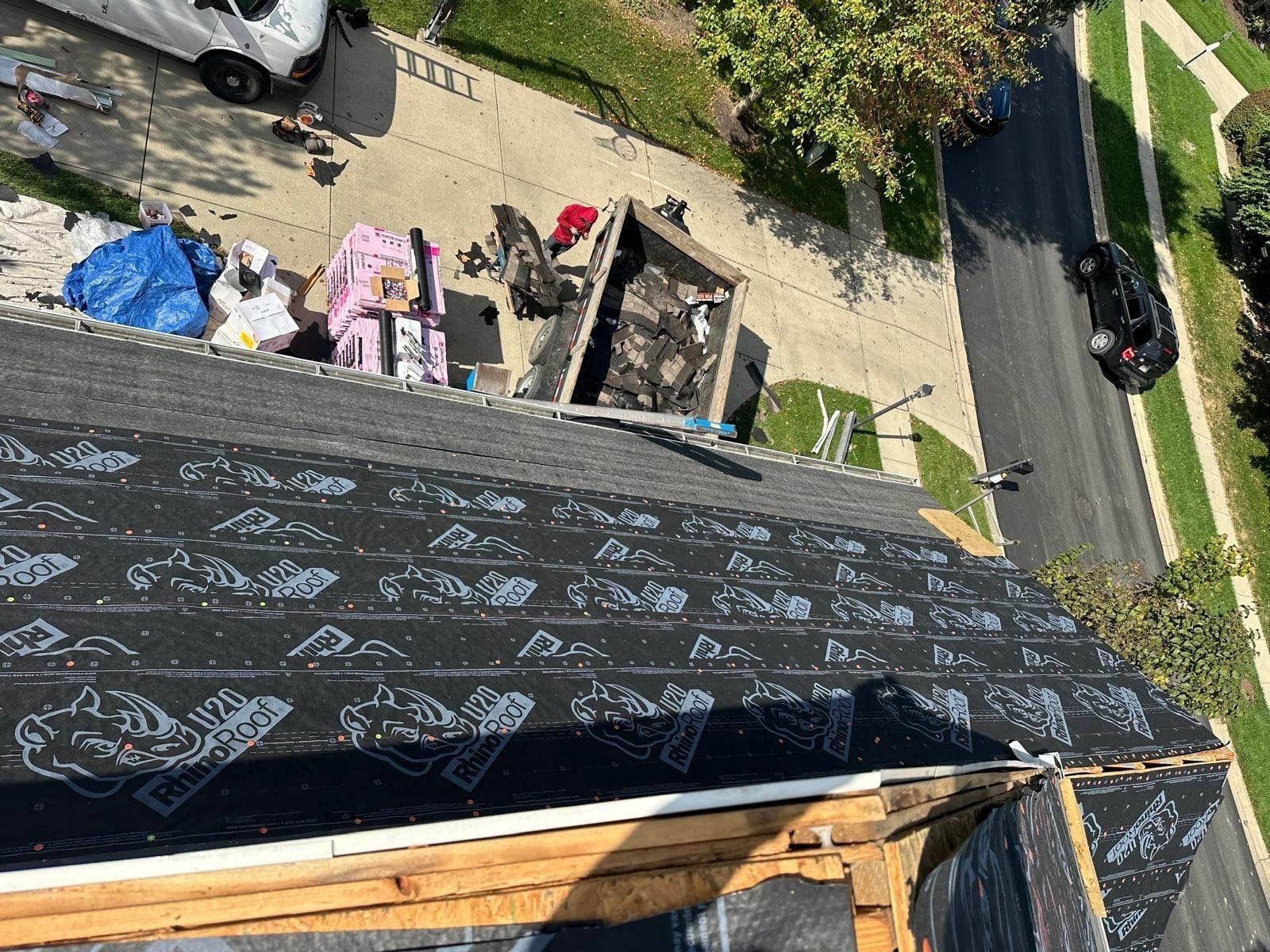 Underlayment along the roof edge above the dump trailer and driveway, Beavercreek, Ohio.