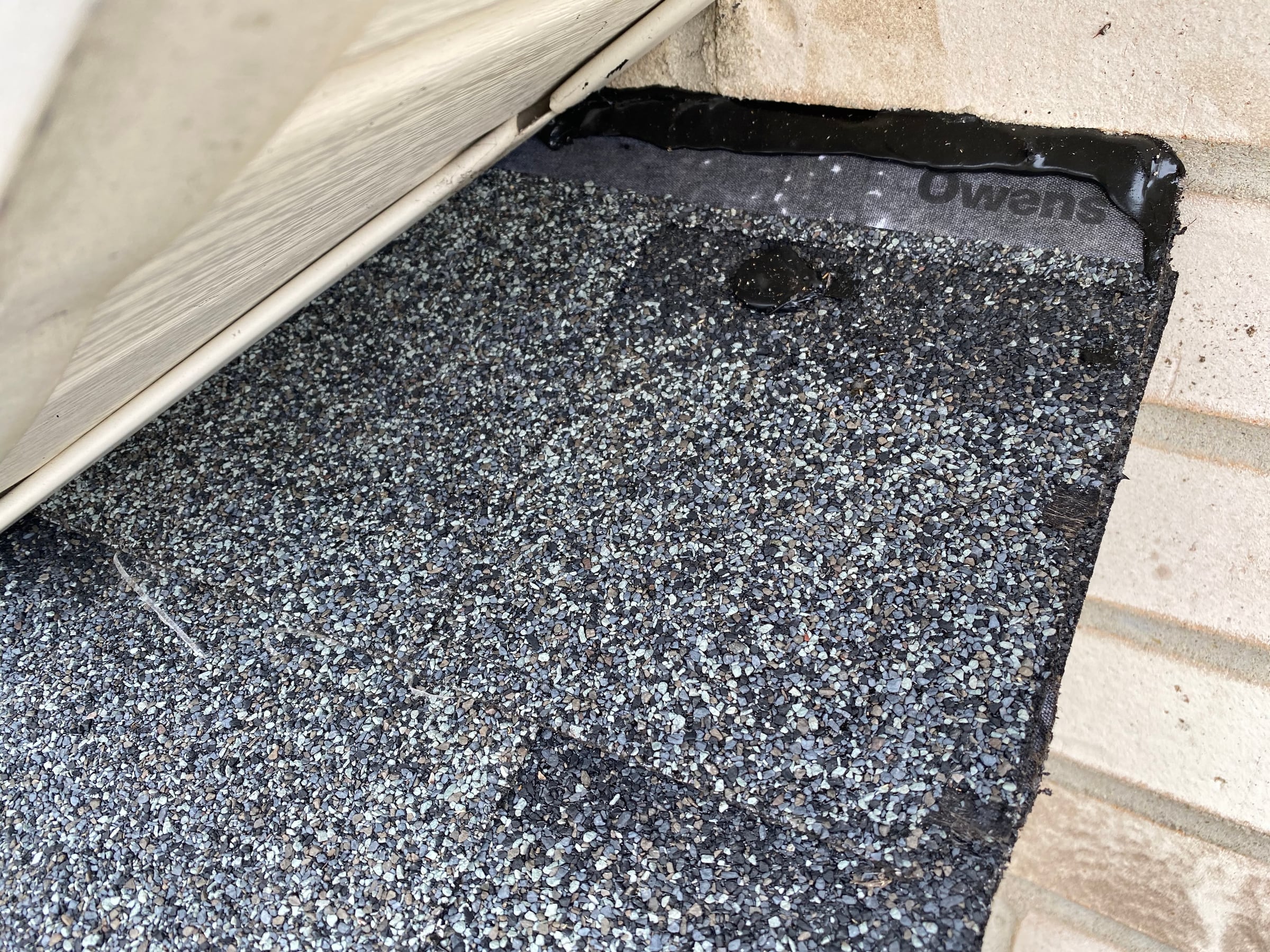 Self-adhered membrane behind the siding