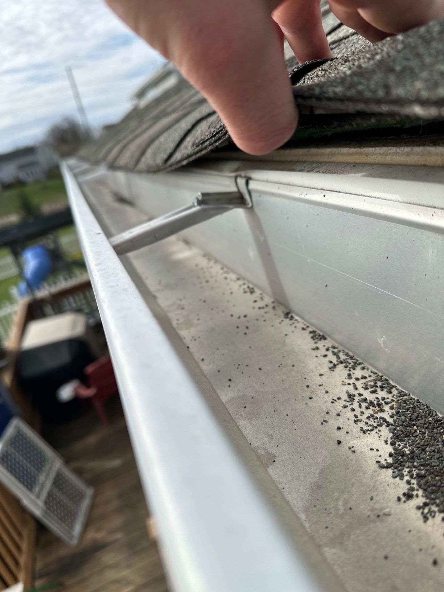Shingle edge above the gutter line