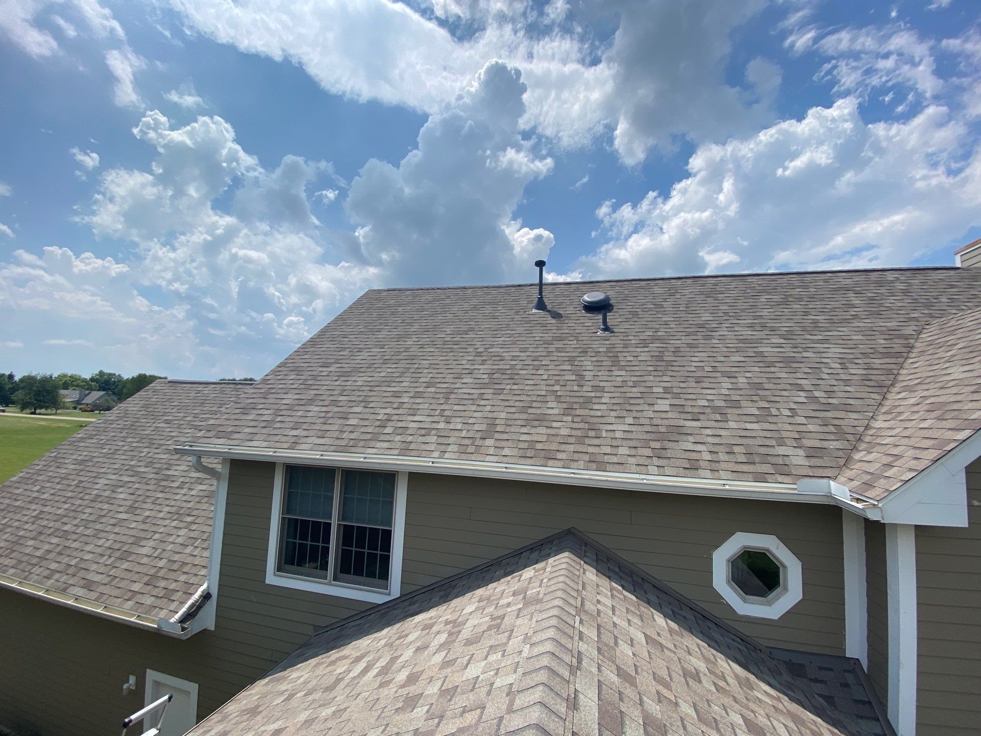 Upper rear roof finished above the lower hip and round window, Yellow Springs, Ohio.