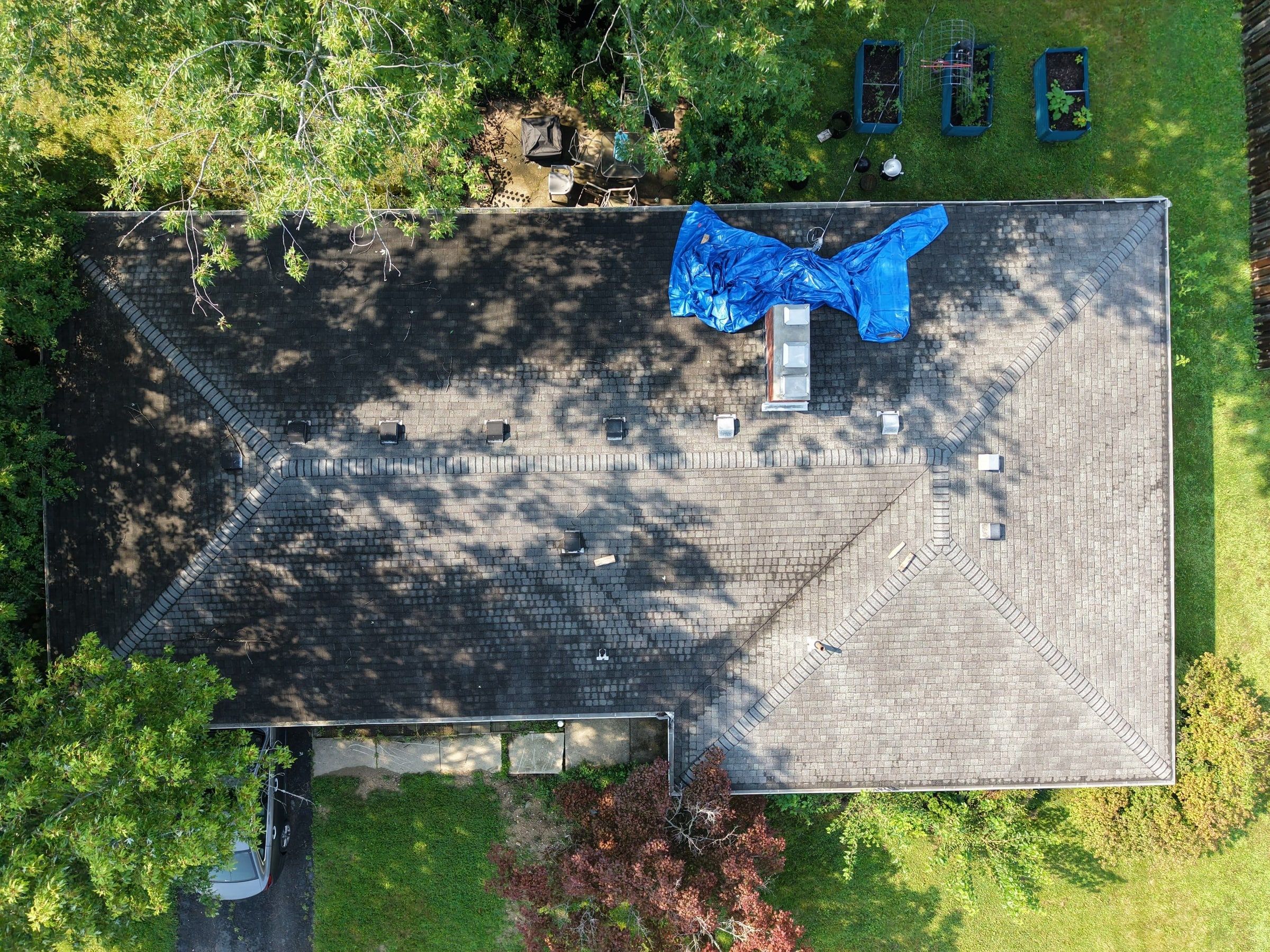 The old roof seen straight down from the air, with the blue tarp near the chimney, Kettering, Ohio.