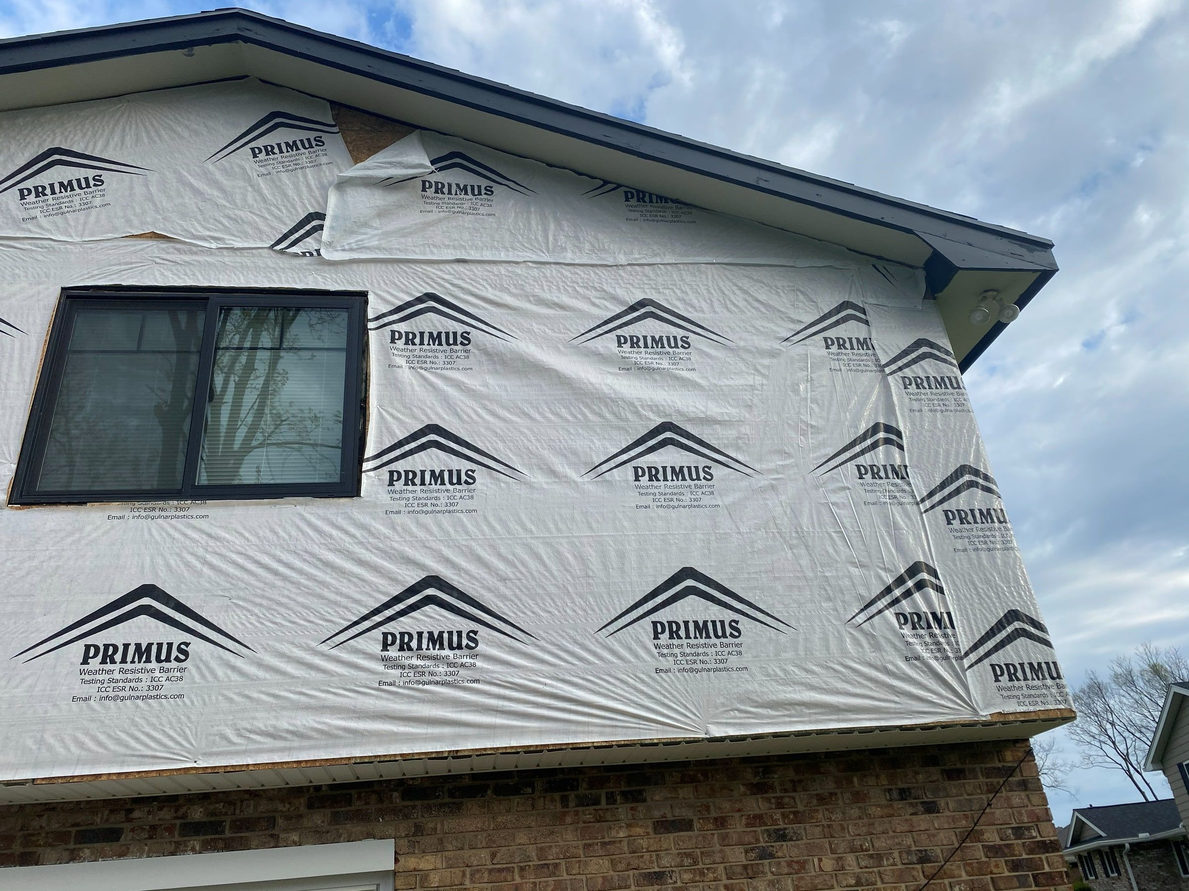 House wrap lapped around the back window, Beavercreek, Ohio.