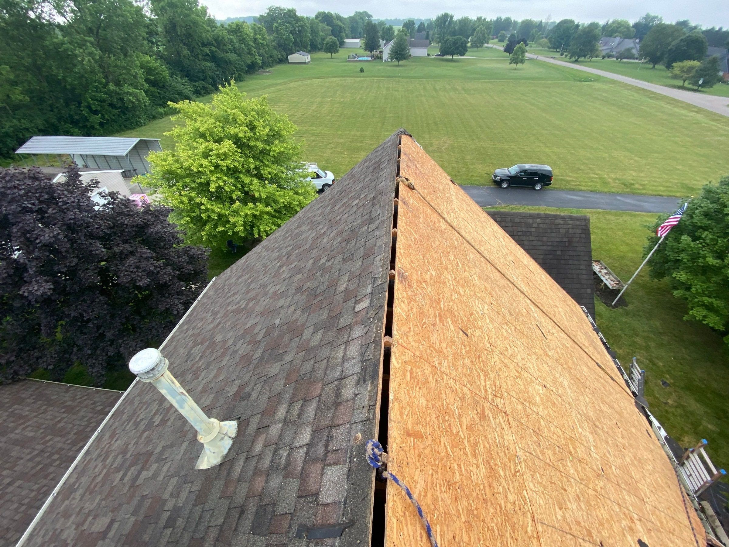 Old shingles on one side of the ridge and bare deck on the other, Yellow Springs, Ohio.