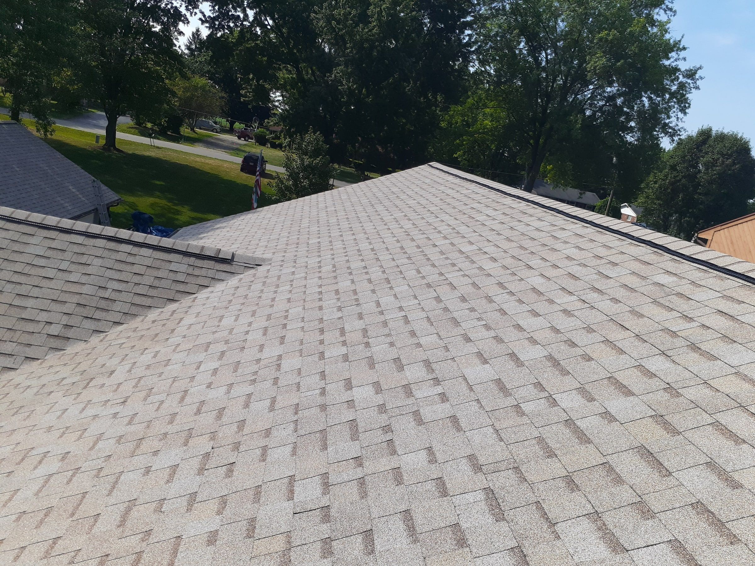 Finished slope meeting a lower roof at a clean valley, Jamestown, Ohio.
