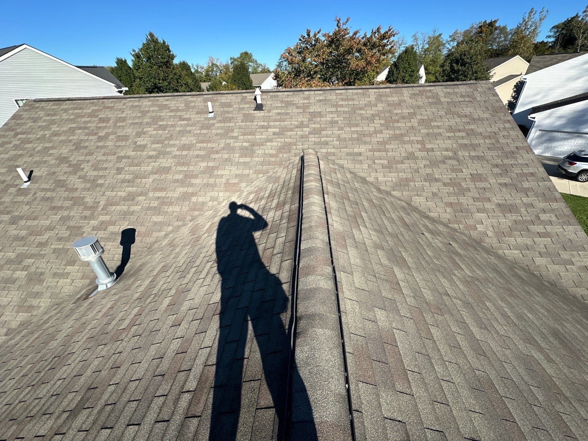 Faded original shingles where two slopes of the old roof meet at a hip, Beavercreek, Ohio.