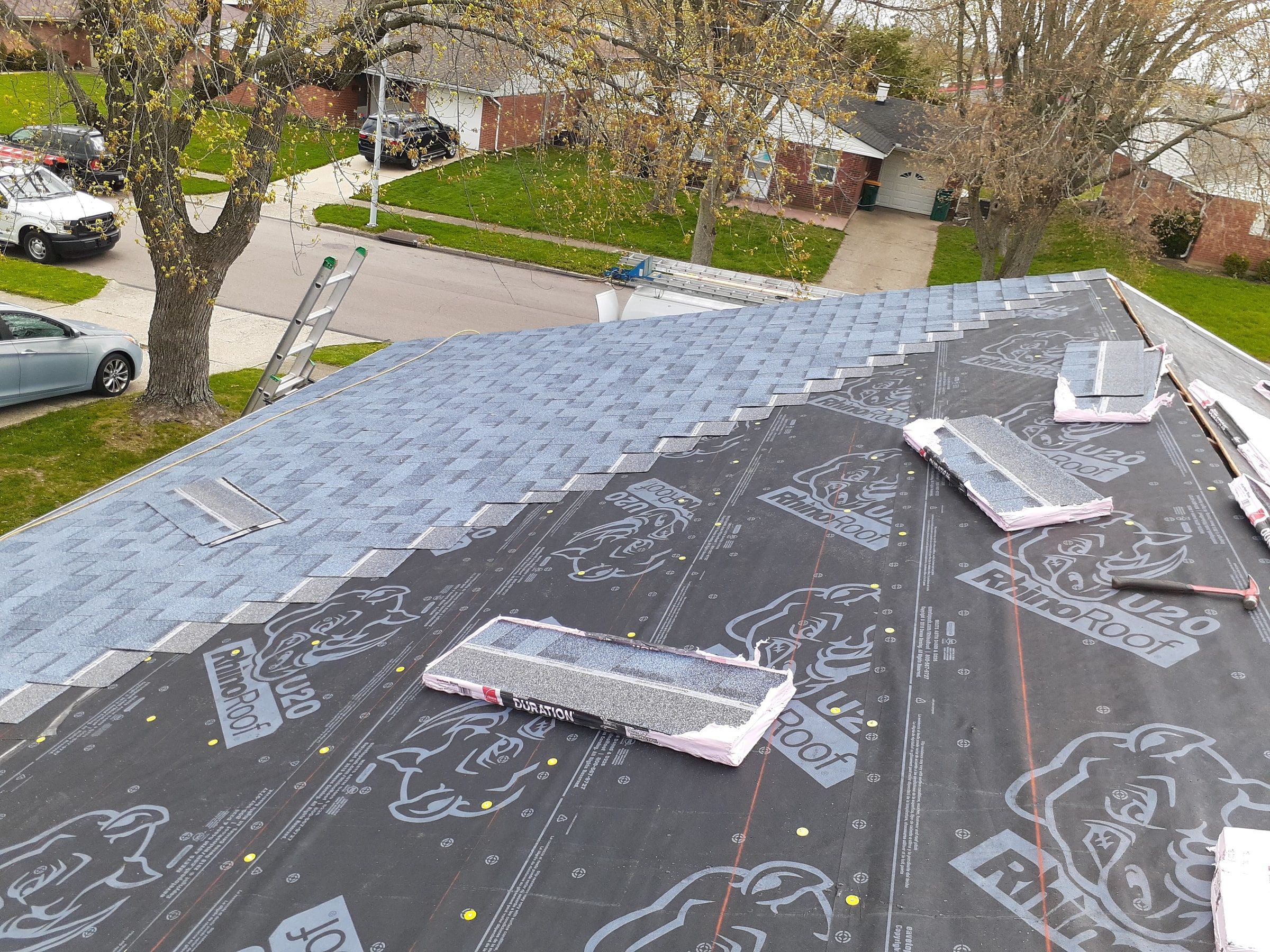 New shingles going on up the slope over the synthetic underlayment, Kettering, Ohio.
