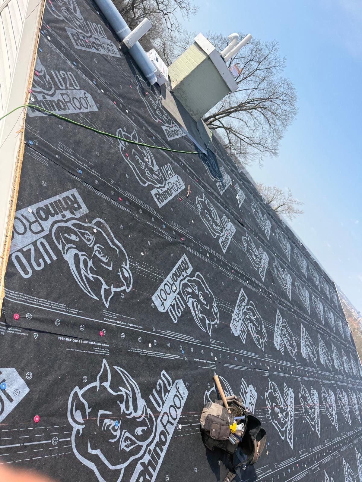 RhinoRoof underlayment covering the slope up to the faux chimney, Dayton, Ohio.