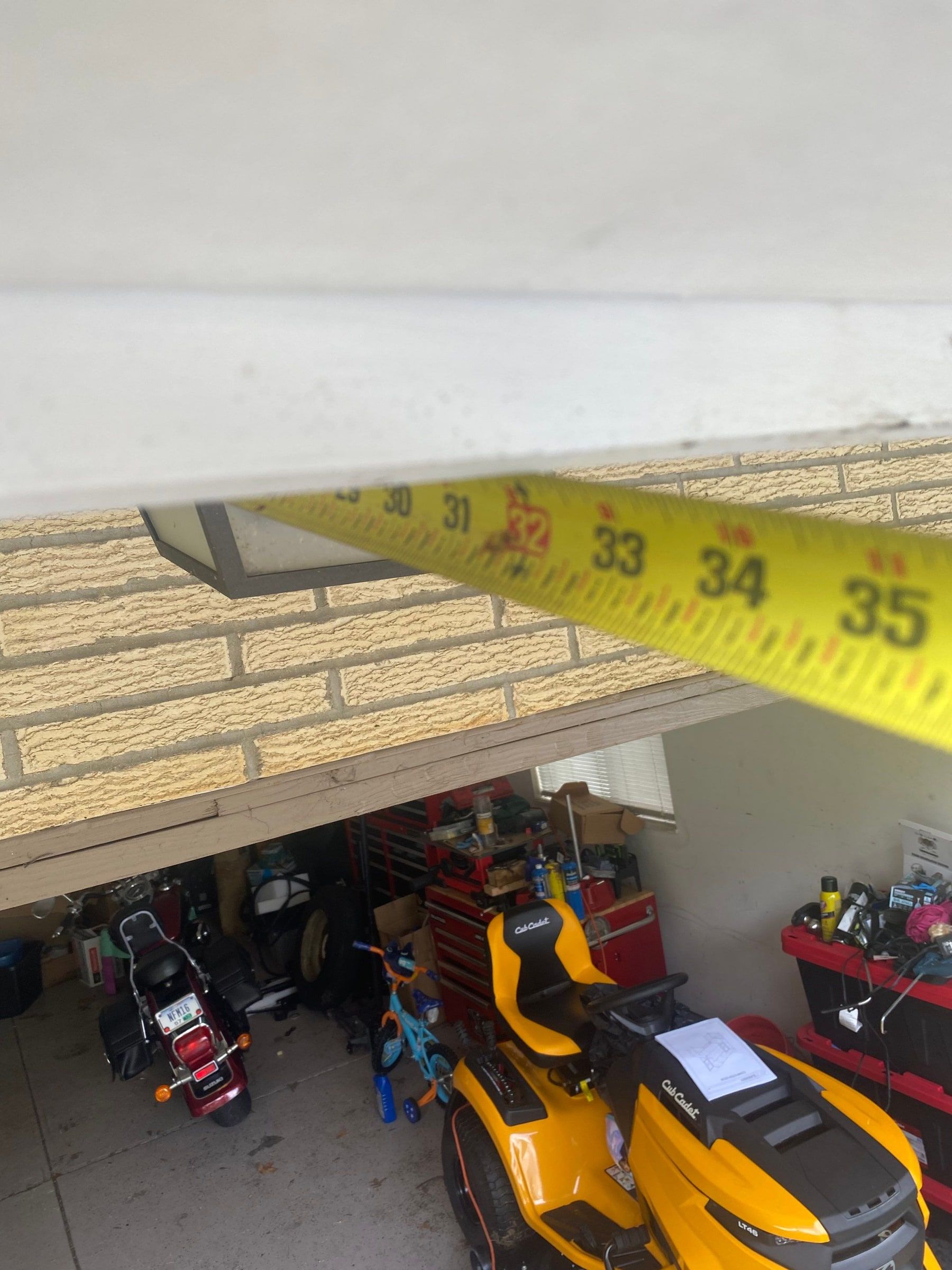 A tape measure across the soffit above the garage, Kettering, Ohio.