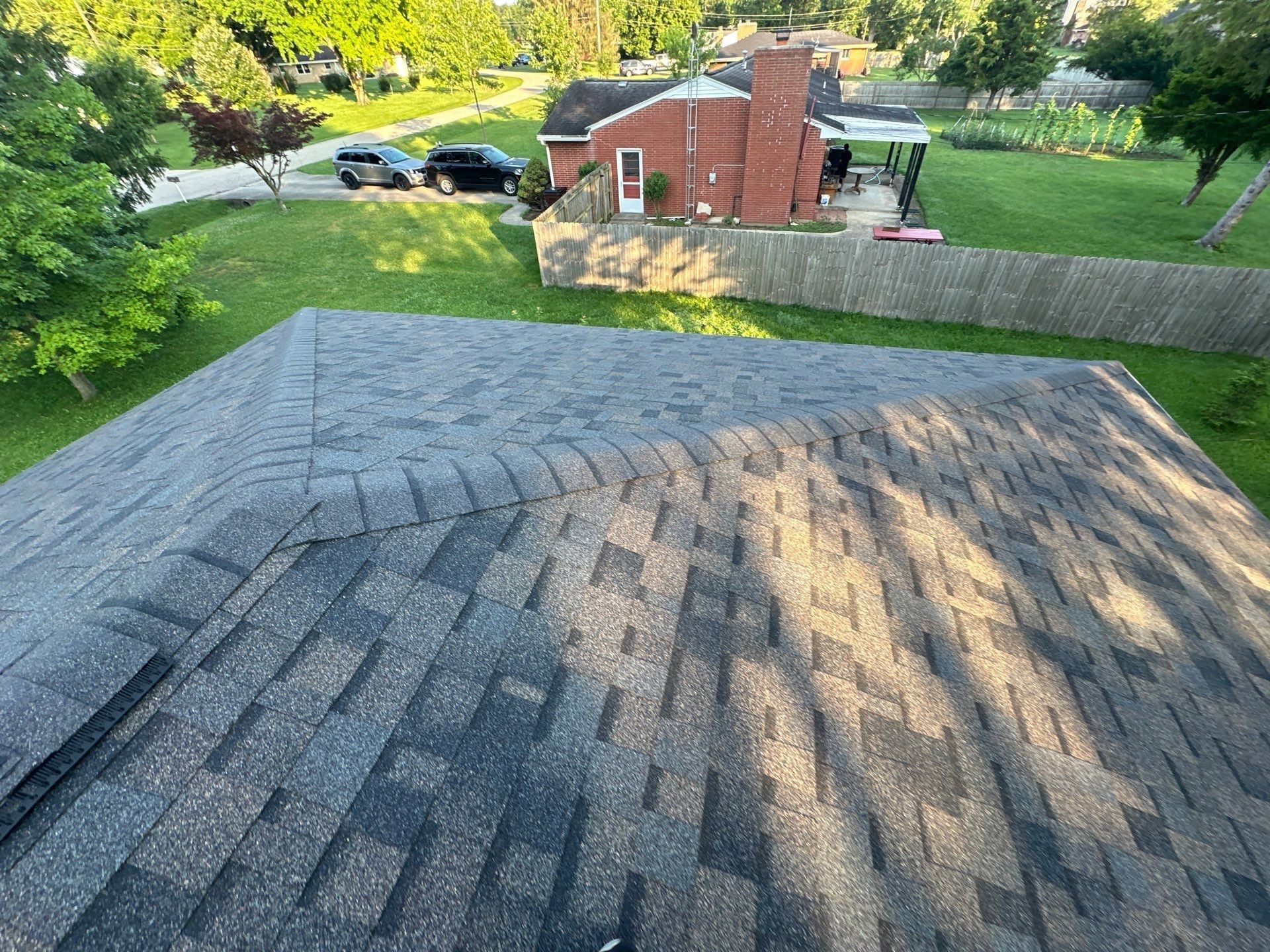 Finished hip end with new ridge caps over the back yard, Beavercreek, Ohio.