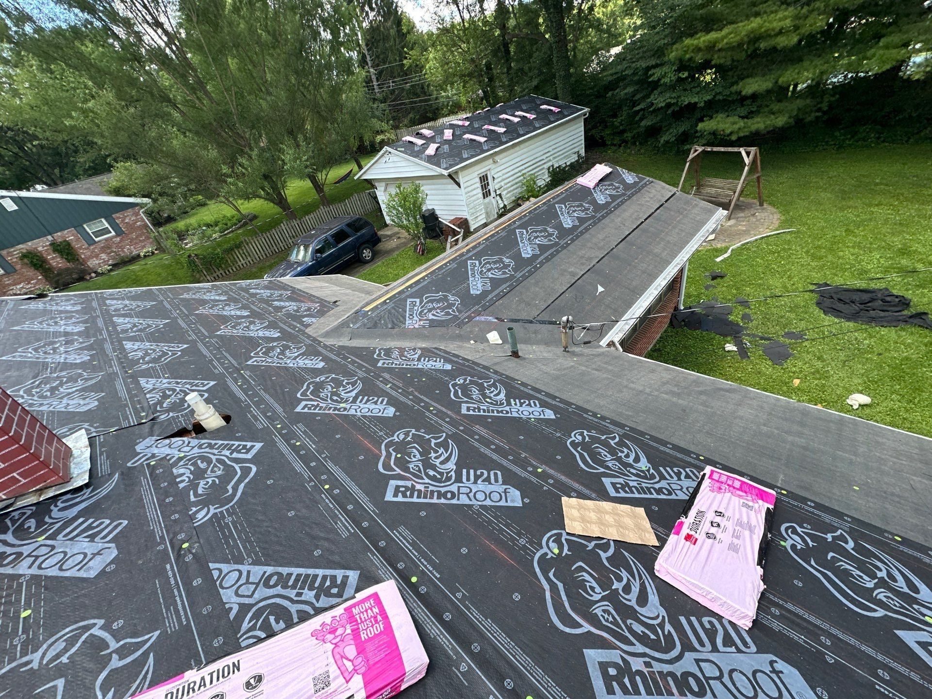 Synthetic underlayment covering the house roof, with shingle bundles ready, Beavercreek, Ohio.