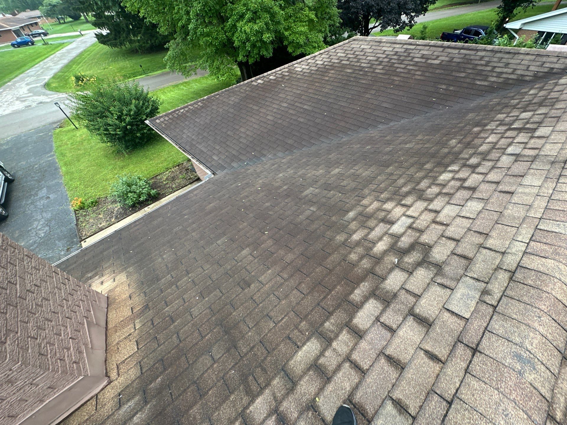 Wide view of an old roof slope stained and faded with age, Beavercreek, Ohio.