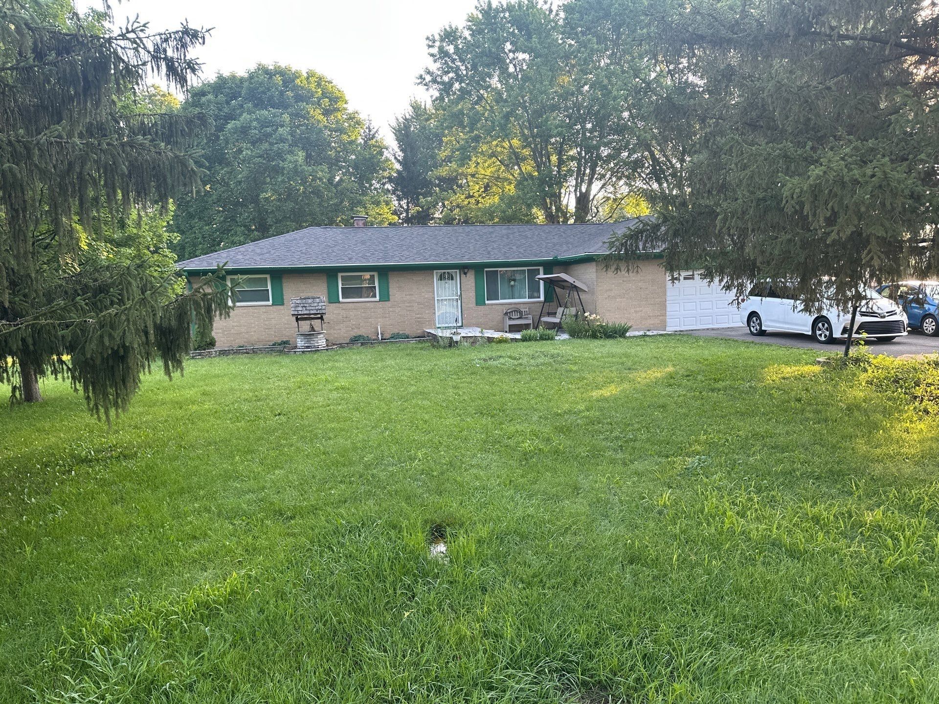 Front yard view of the ranch home under its new darker roof, Beavercreek, Ohio.