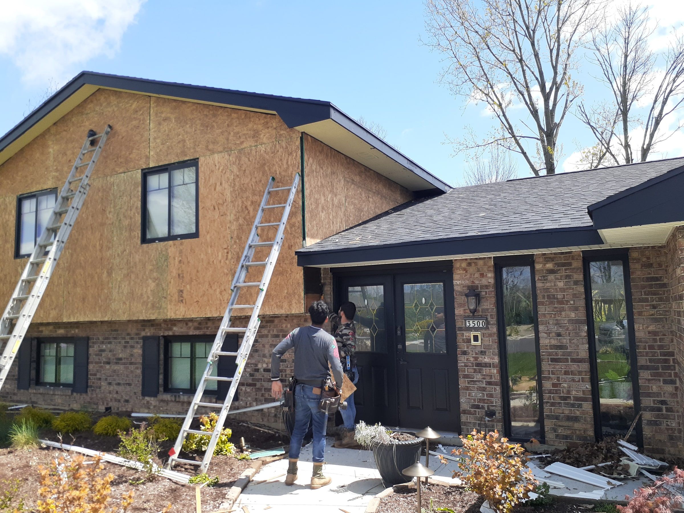 OSB sheathing on the front, with the crew by the front door, Beavercreek, Ohio.