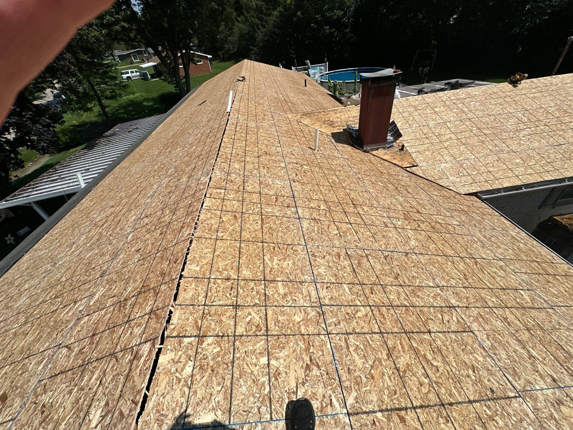 New OSB sheathing up to the chimney, Beavercreek, Ohio.