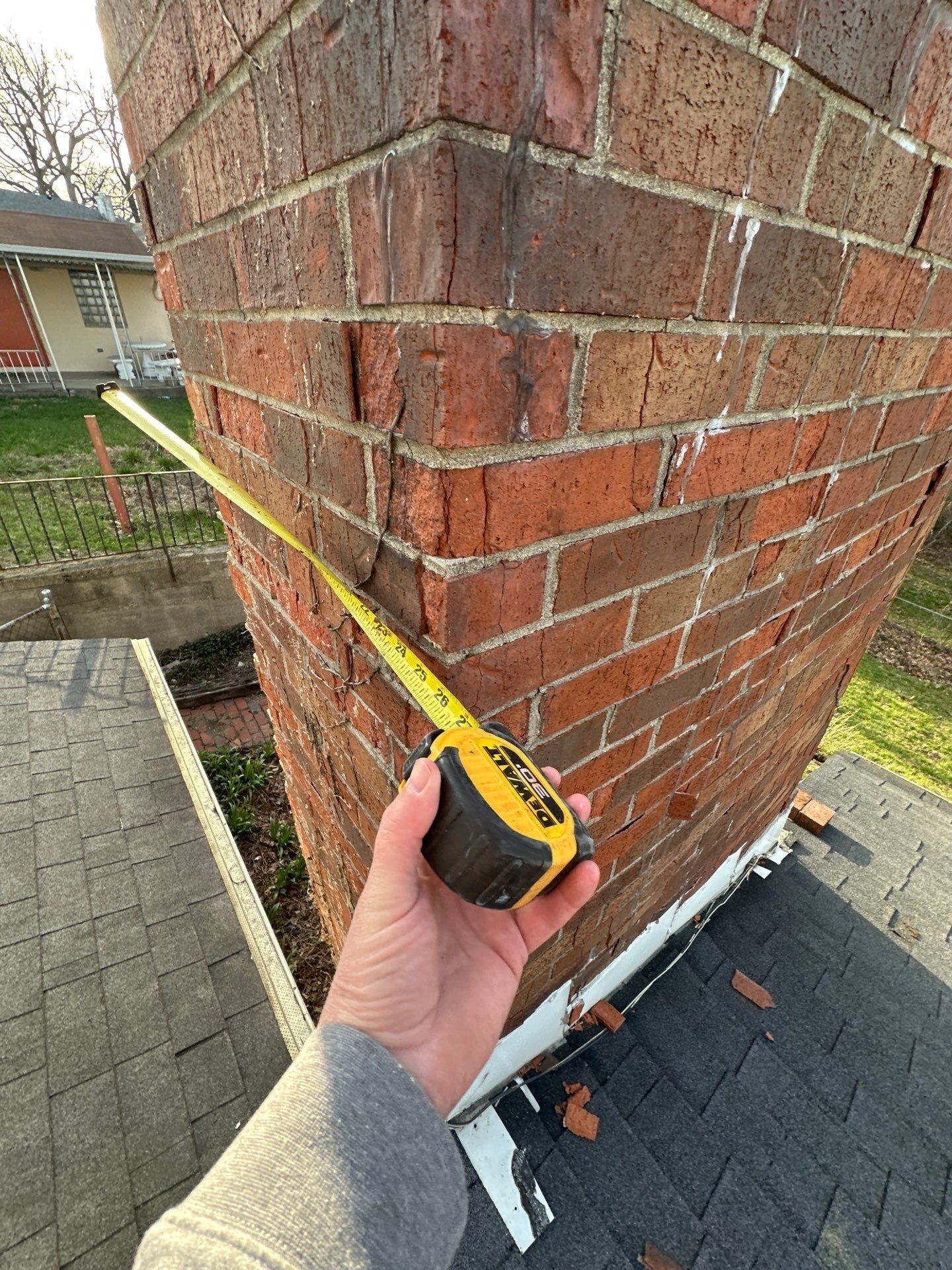 Tape measure at the brick chimney
