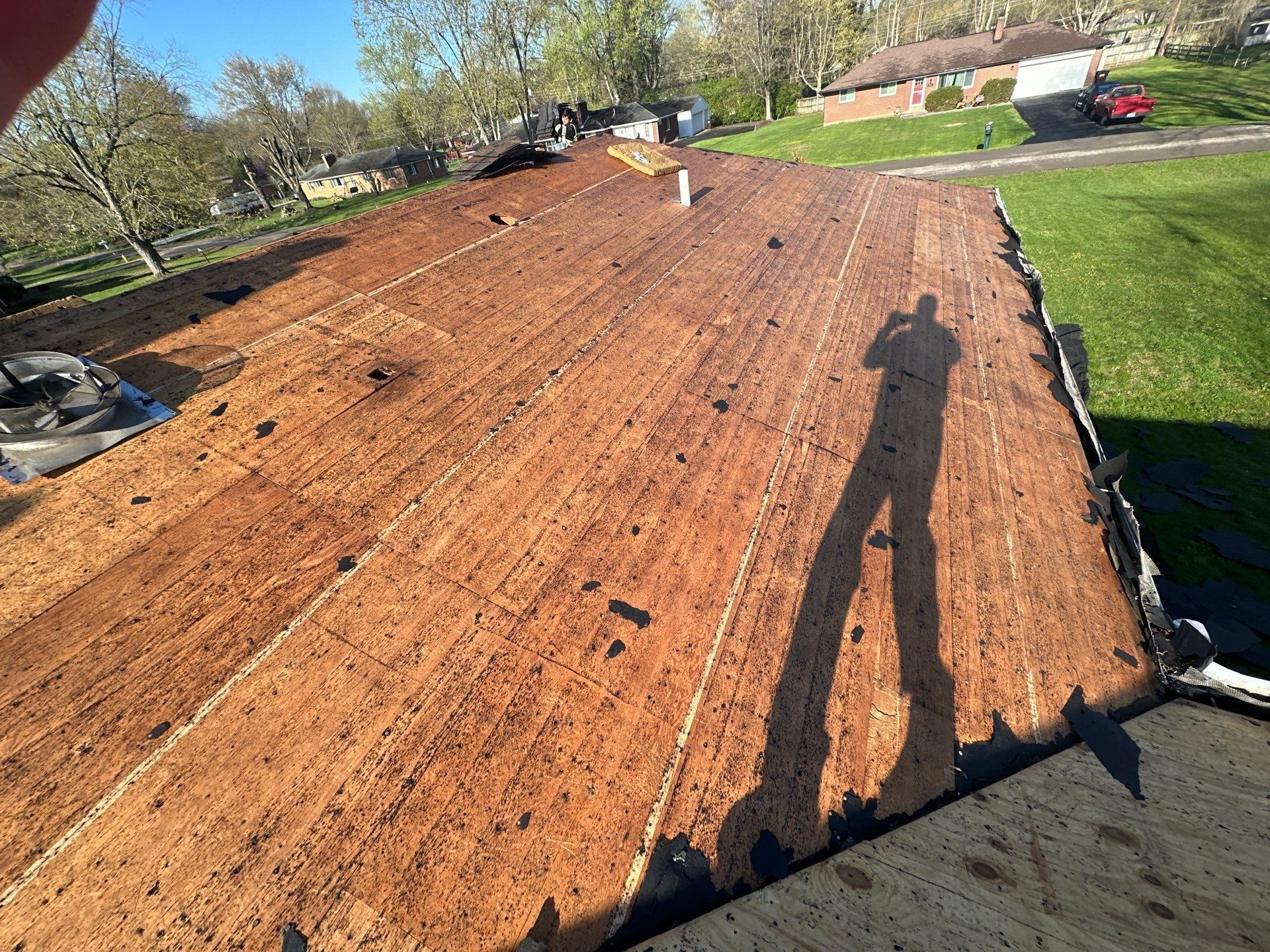 Board deck on the front slope fully stripped with the photographer shadow, Beavercreek, Ohio.