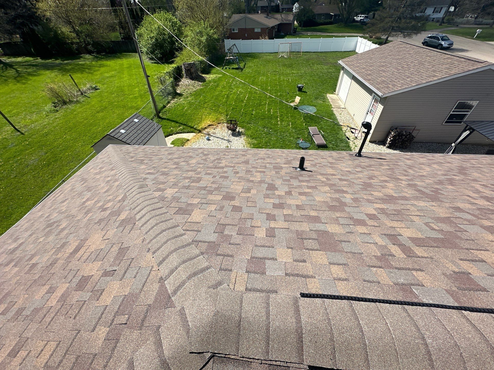 The finished roof with the garage across the yard, Beavercreek, Ohio.