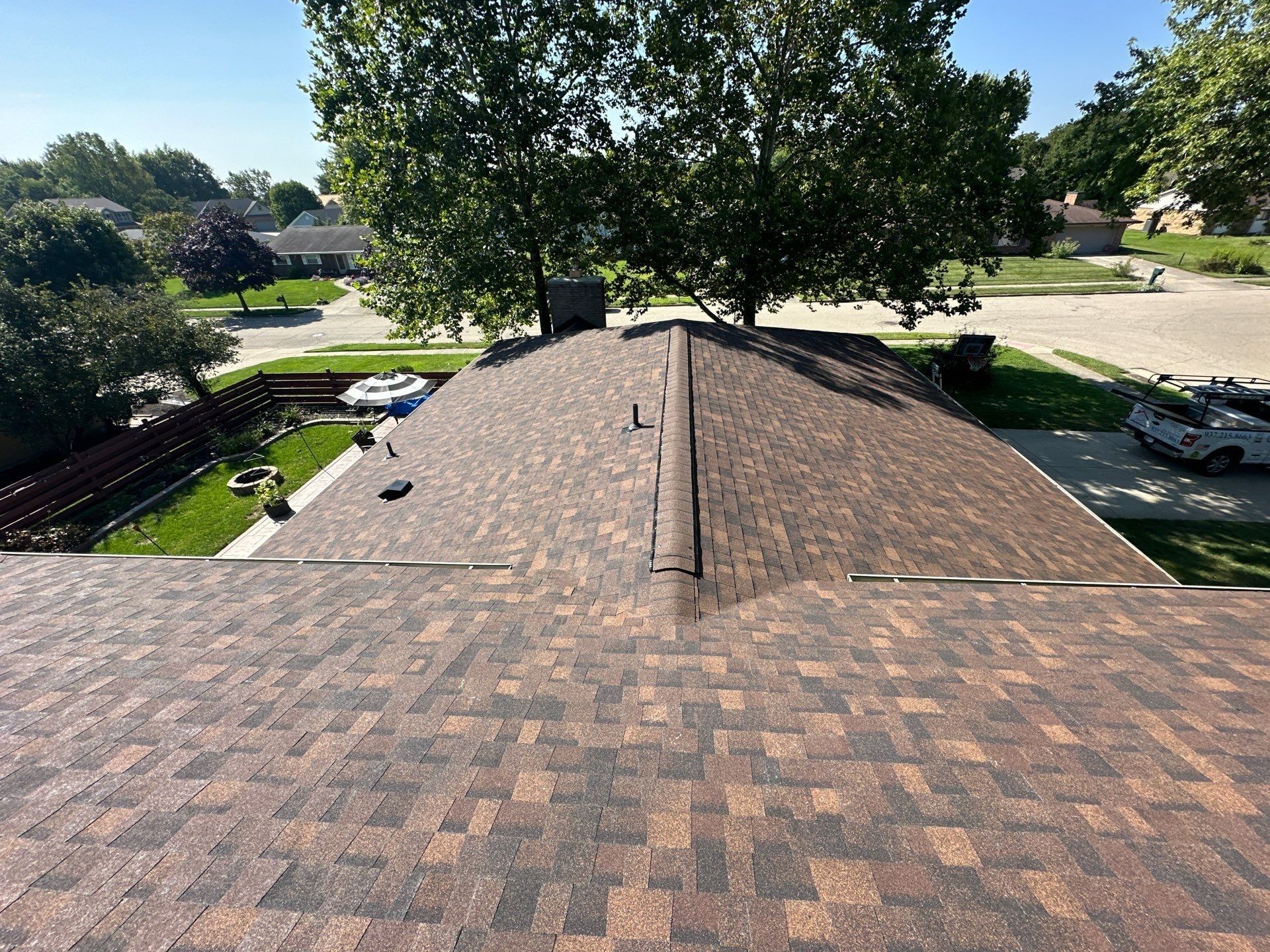The finished roof running to the front, with the street and trees beyond, Dayton, Ohio.