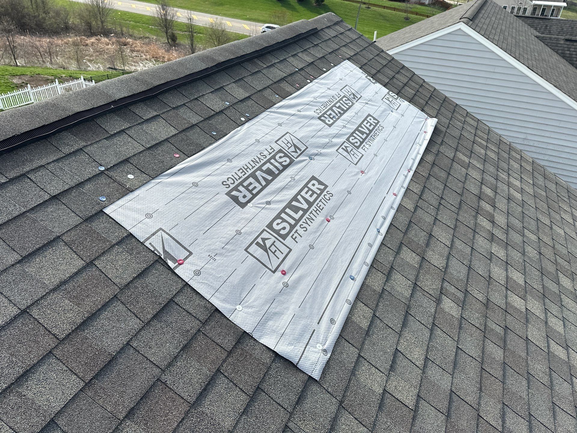 A temporary cover nailed over the damaged roof before the work, Xenia, Ohio.