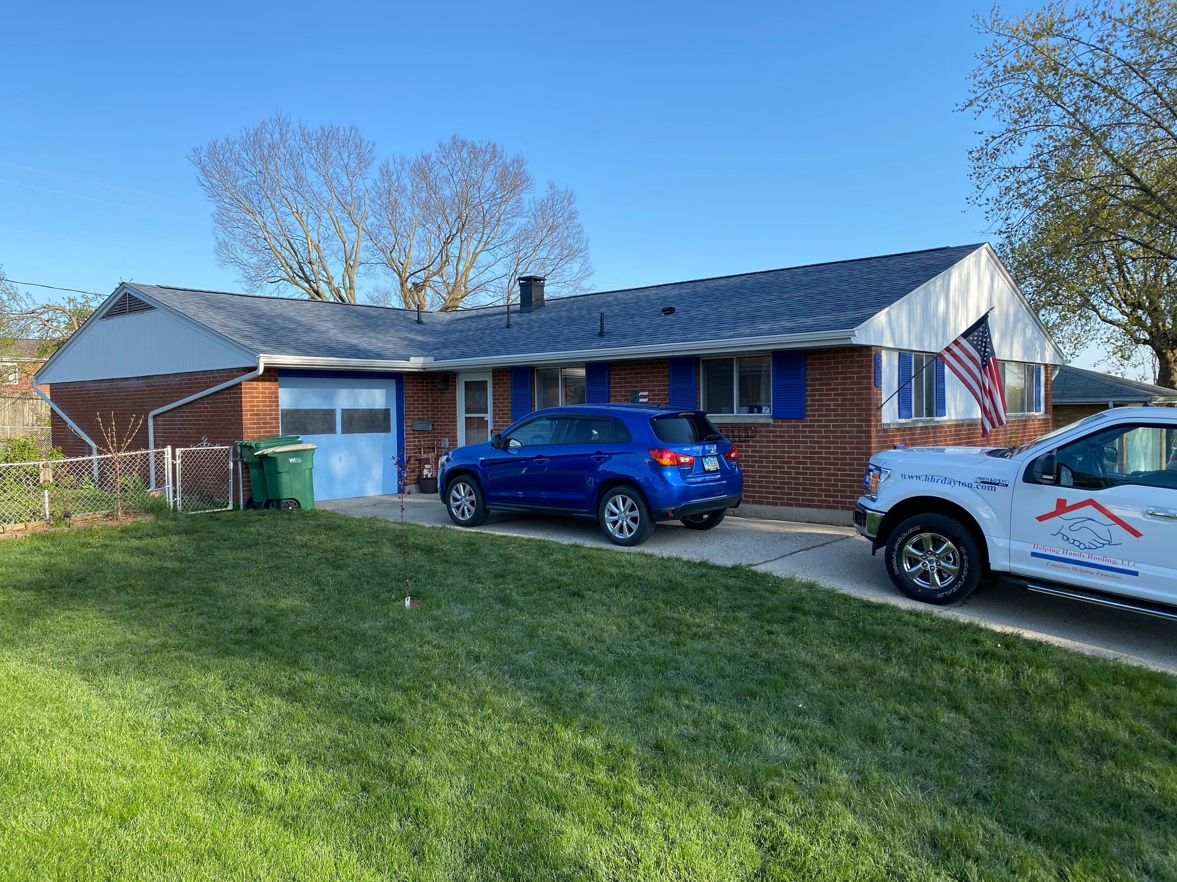 The brick ranch and its new roof from the front lawn, Kettering, Ohio.