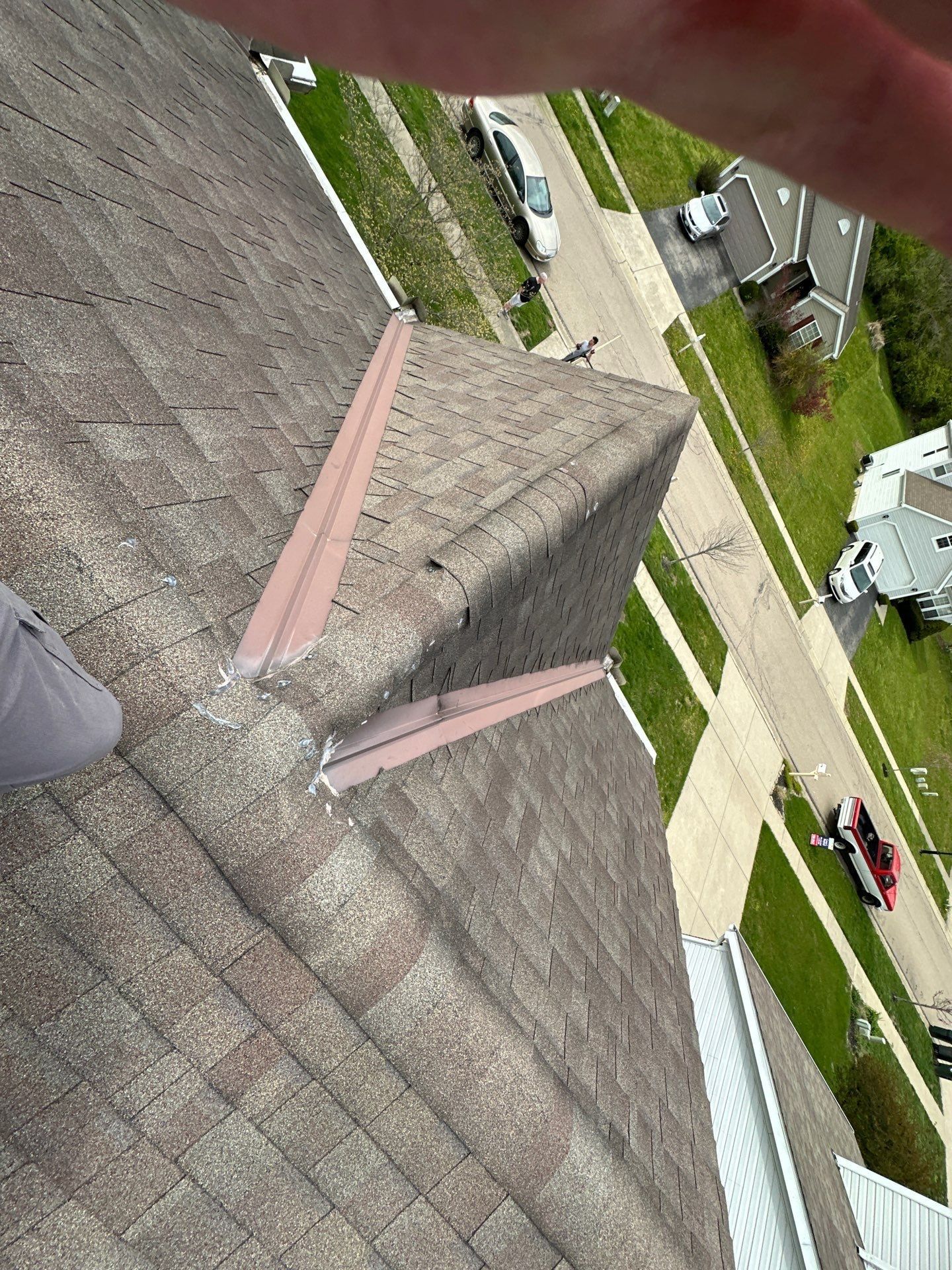Cap shingles separated along two hips