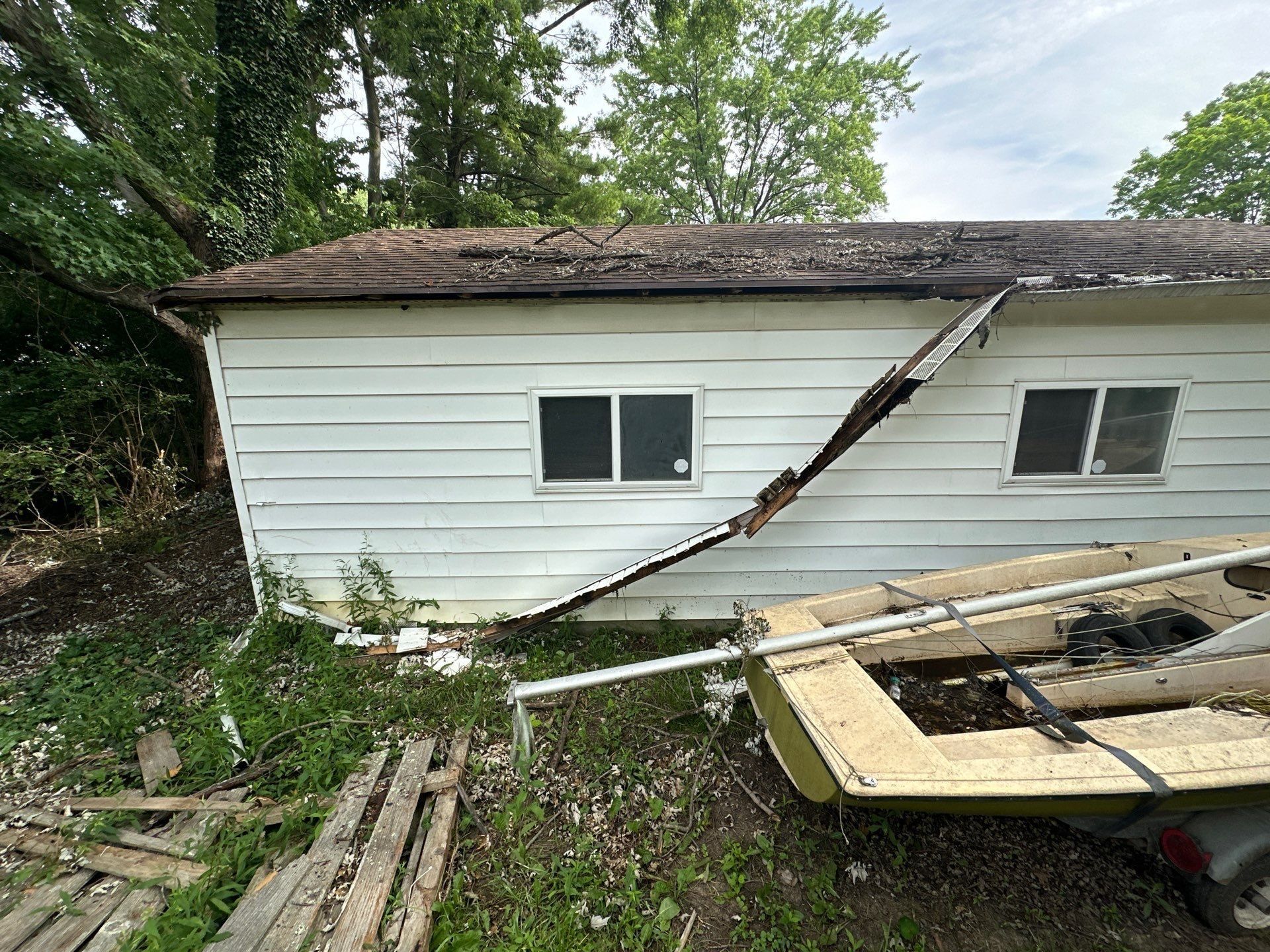 The side of the detached garage with its fascia and gutter pulled away, Beavercreek, Ohio.