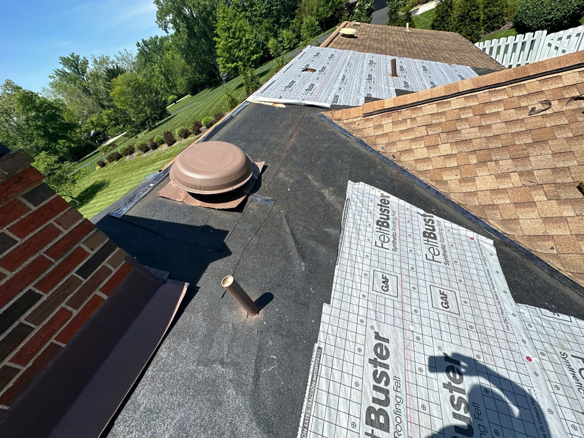 Underlayment around a vent and pipe