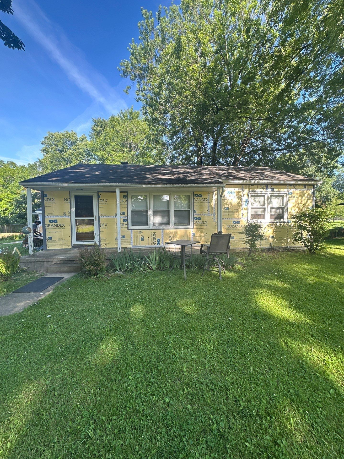 The whole front of the house wrapped in insulation board, Beavercreek, Ohio.