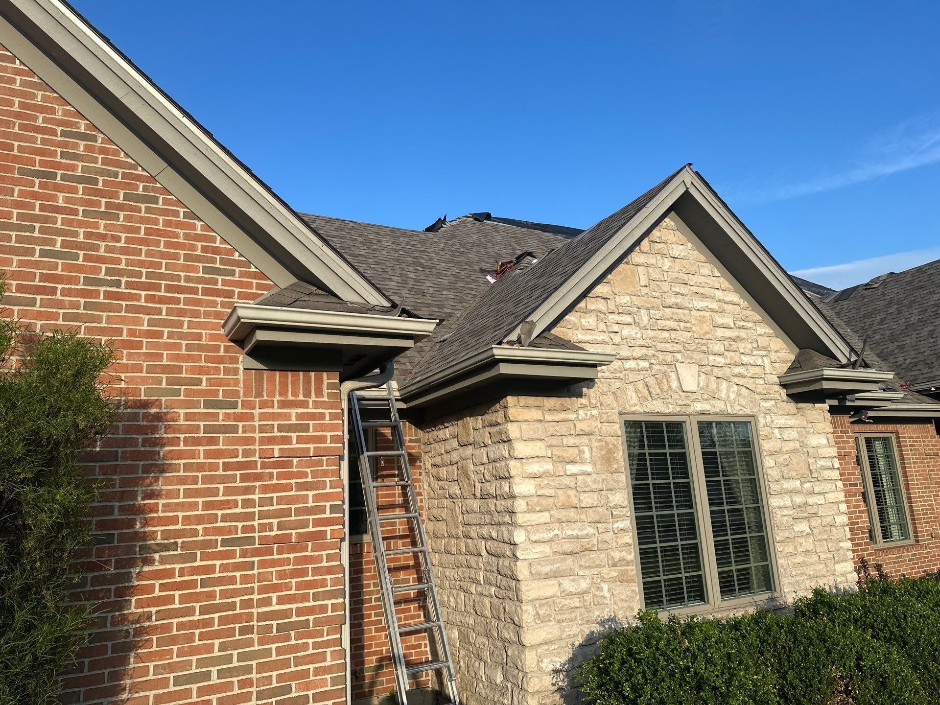Ladder at the eave above the brick