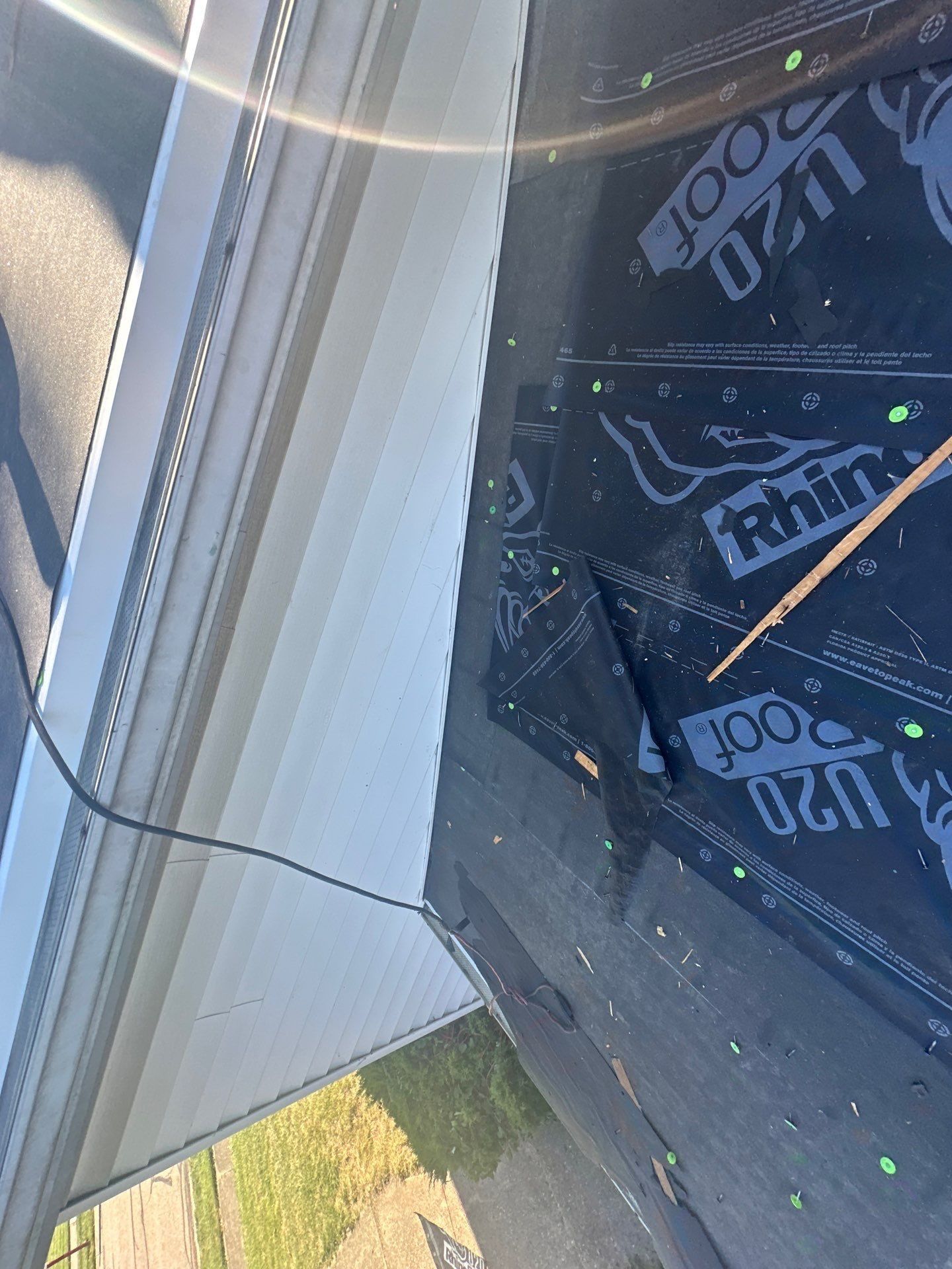 Underlayment turned up the corner where the roof meets the house wall, West Carrollton, Ohio.