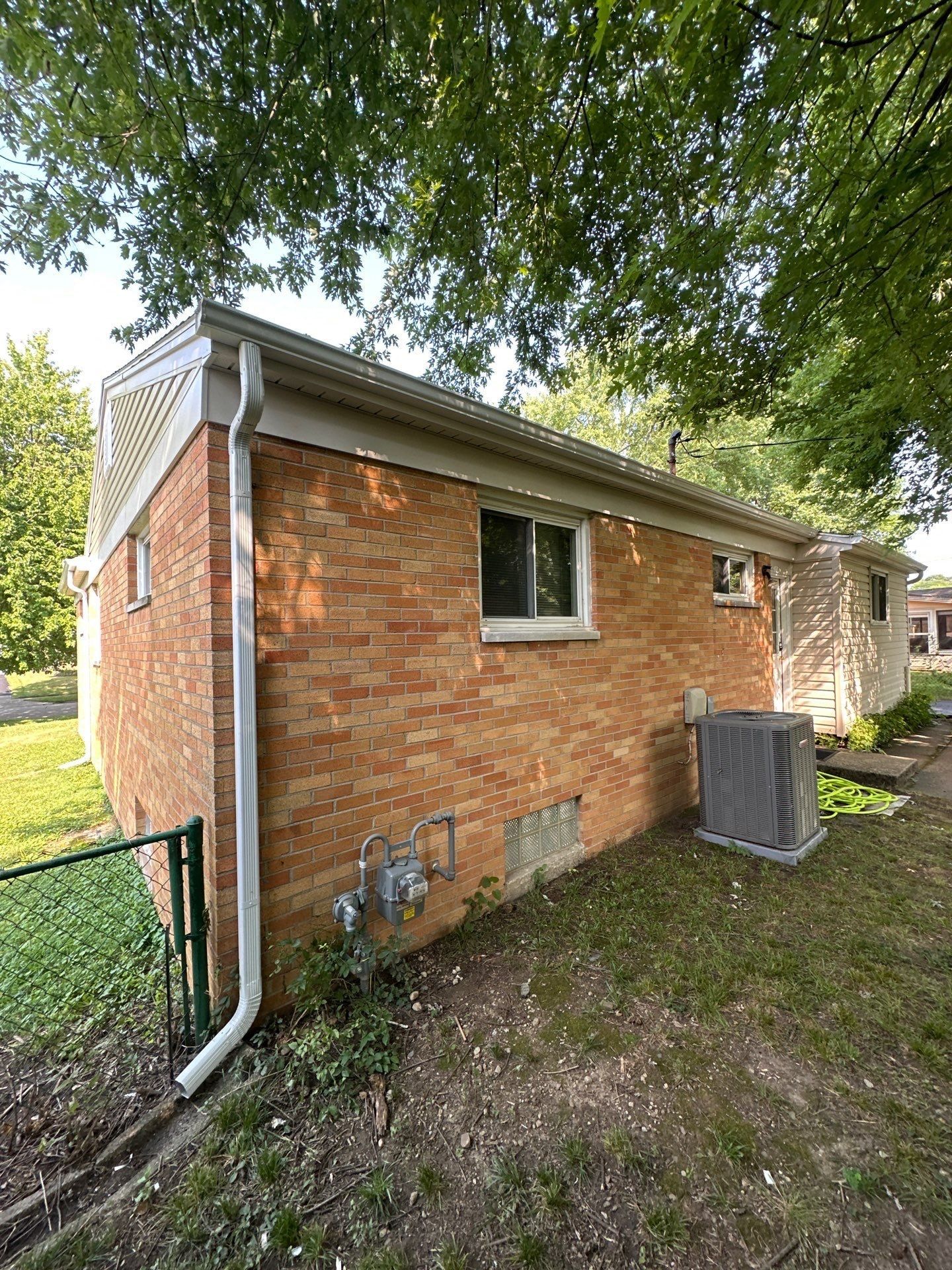 Rear corner gutter and downspout