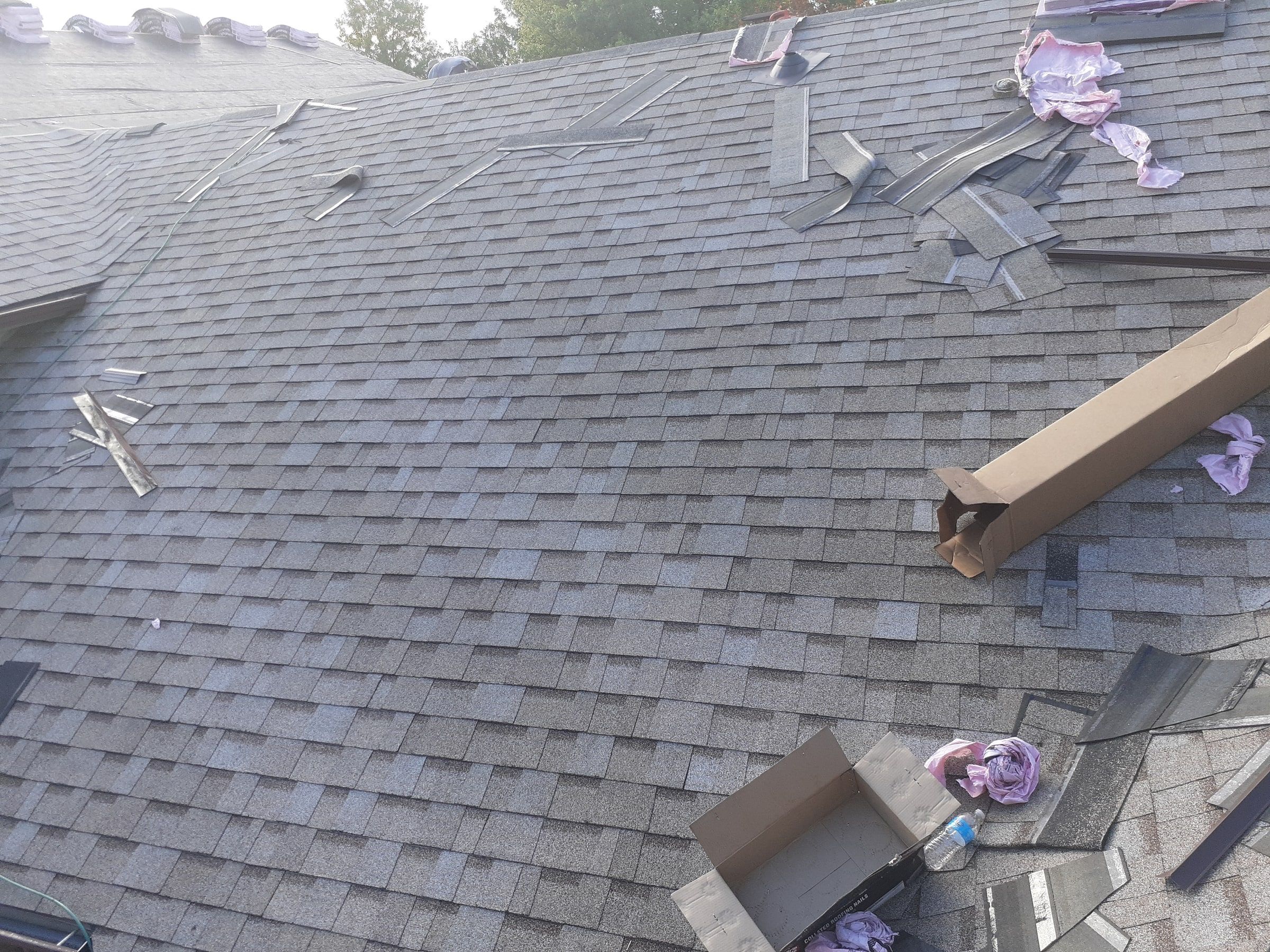First courses of the new shingles going on with cutoffs nearby, Jamestown, Ohio.