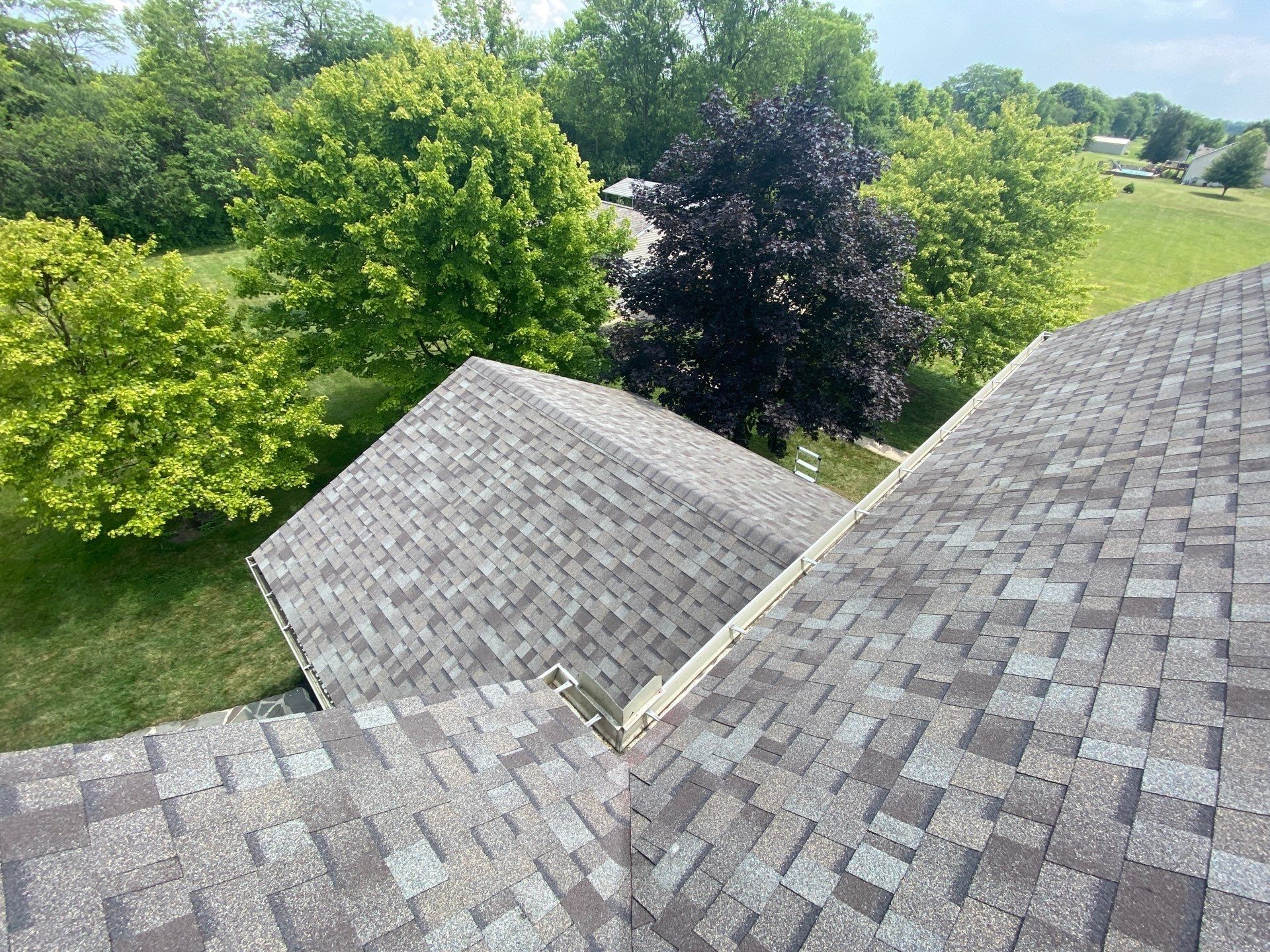 Finished rear porch roof tied into the main slope, Yellow Springs, Ohio.