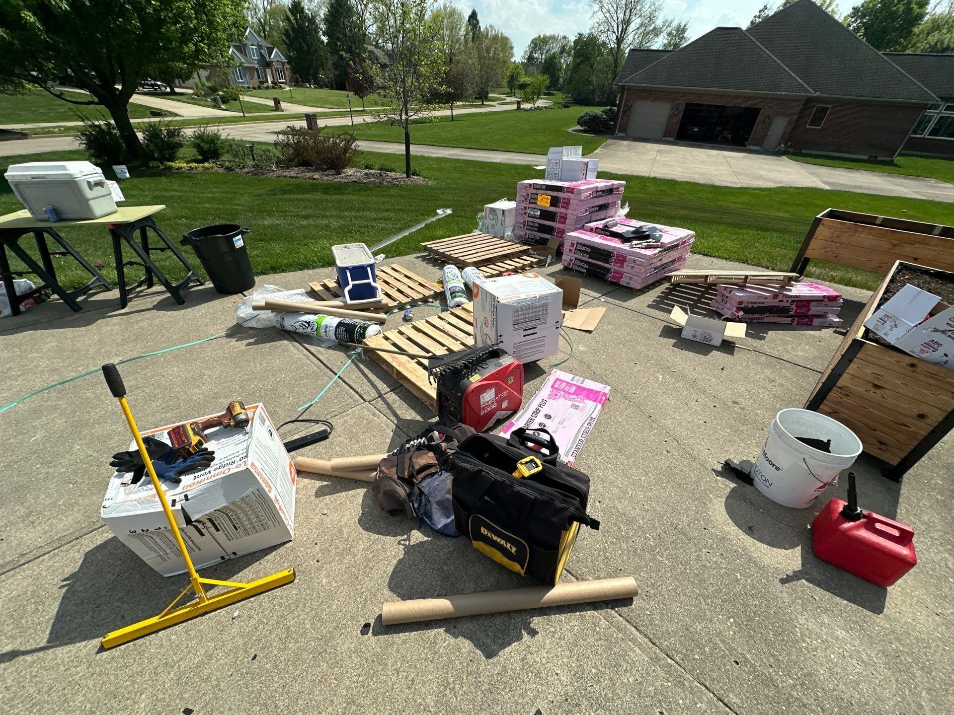 Tools, material and magnet sweeper on the driveway