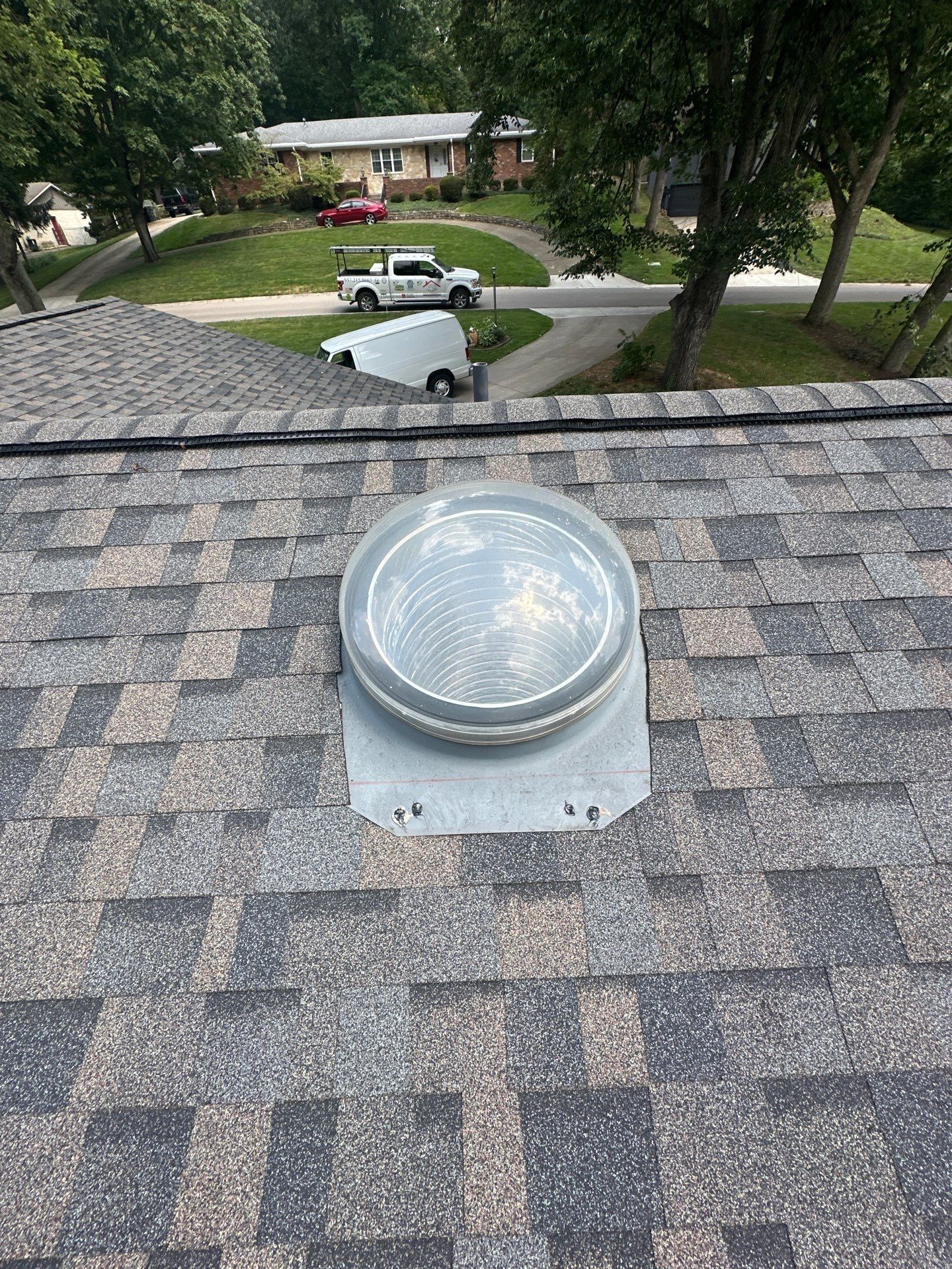 Domed skylight through the shingle courses