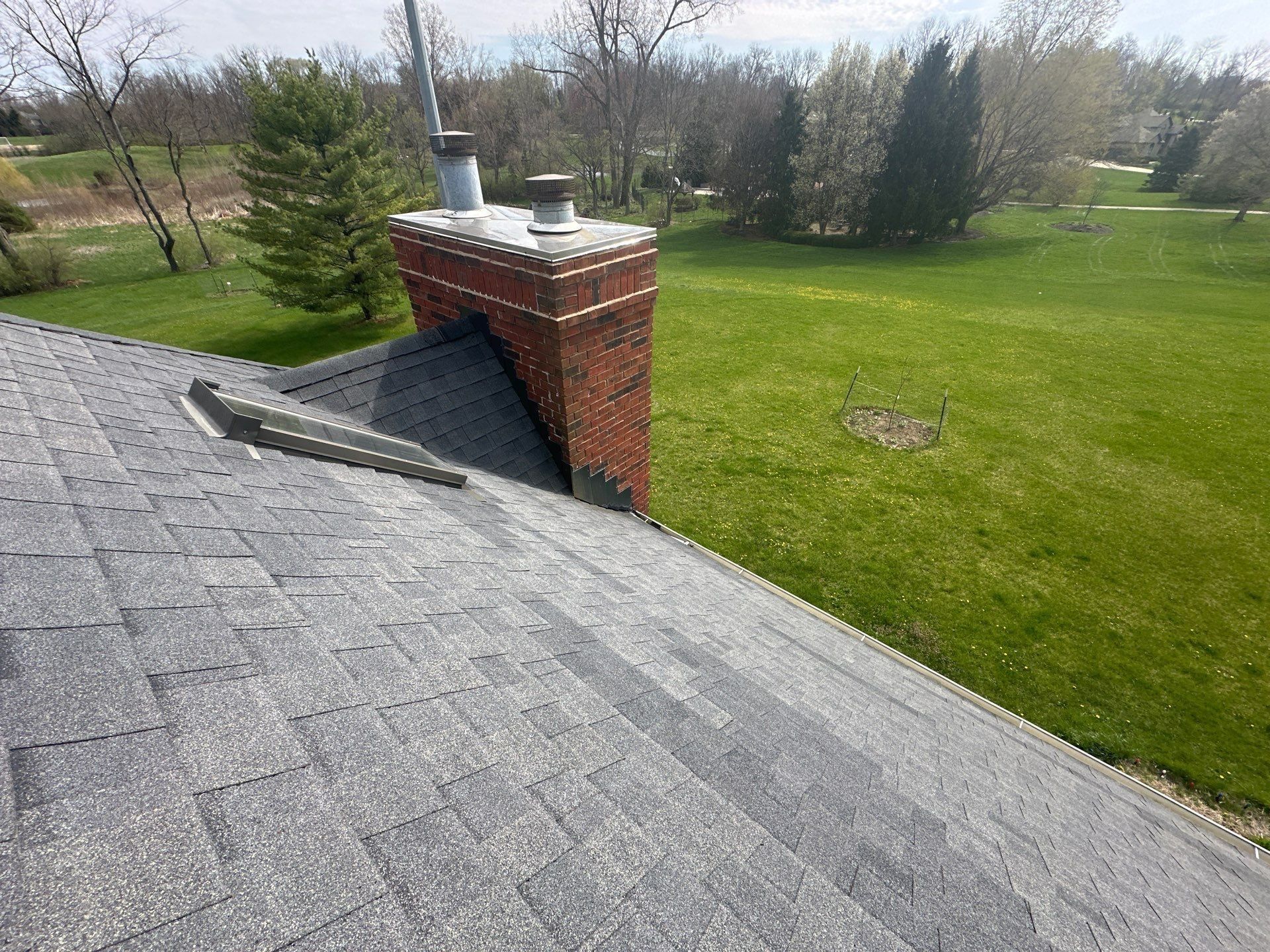 The brick chimney on the roof above the backyard, Xenia, Ohio.