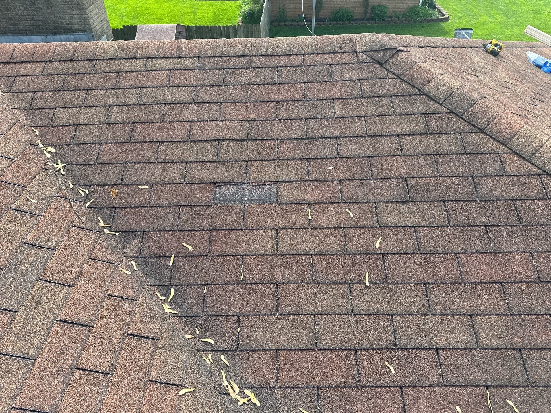 Bare spot on the slope where wind tore away a section of shingles, Beavercreek, Ohio.