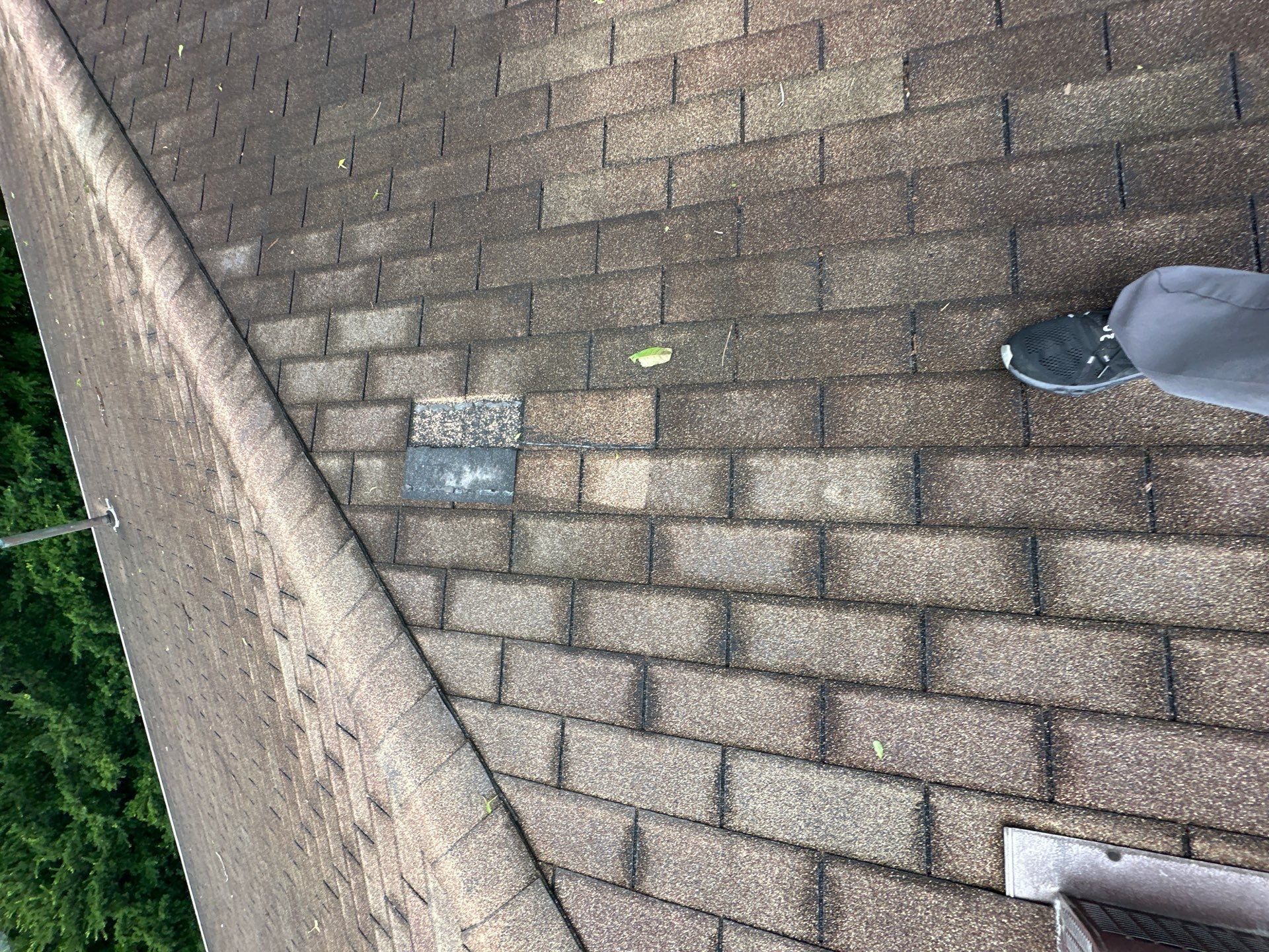 Odd colored patch shingle on the old roof slope near the hip, Beavercreek, Ohio.