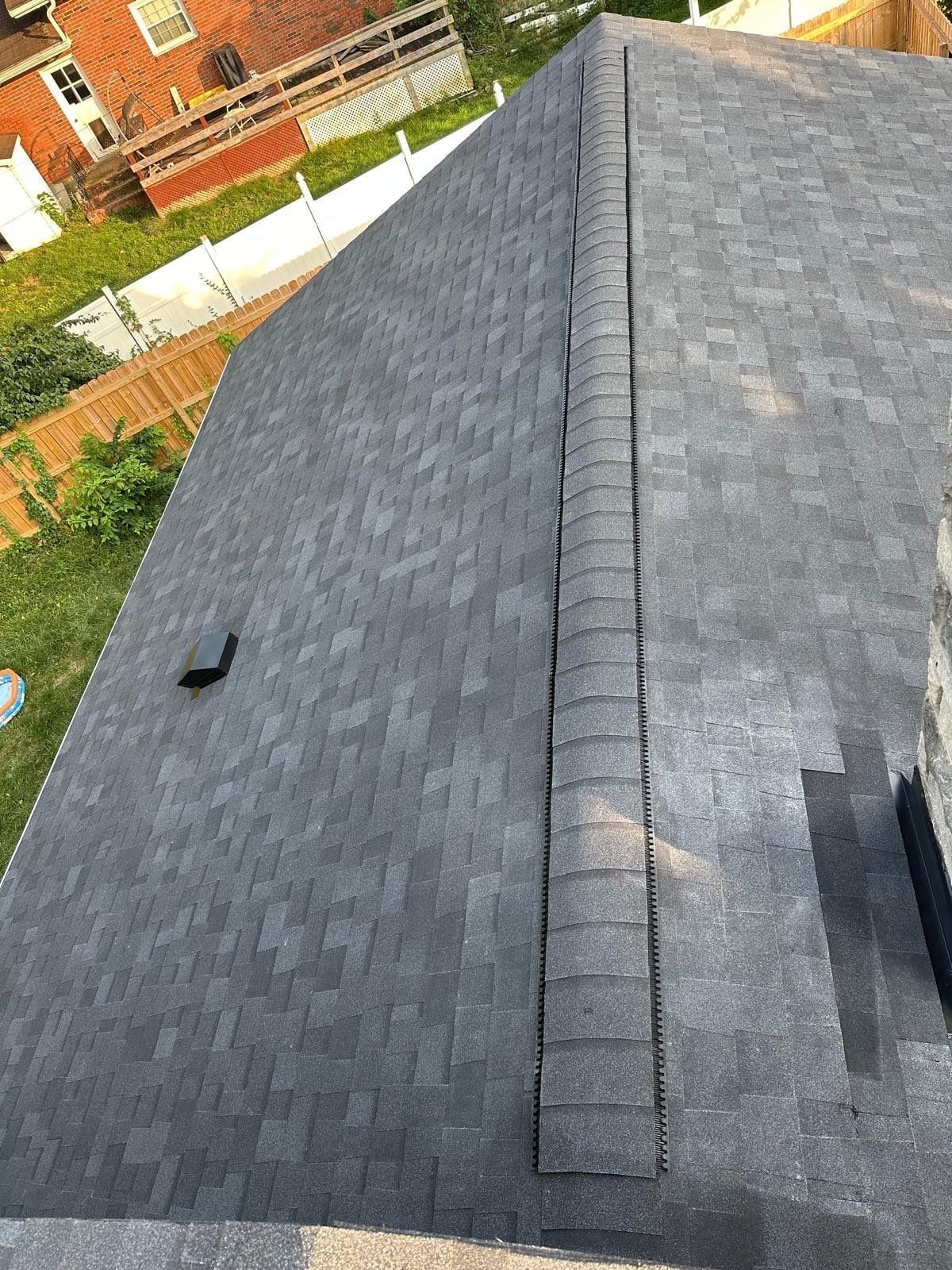 The finished upper roof and ridge vent above the back yard, Fairborn, Ohio.