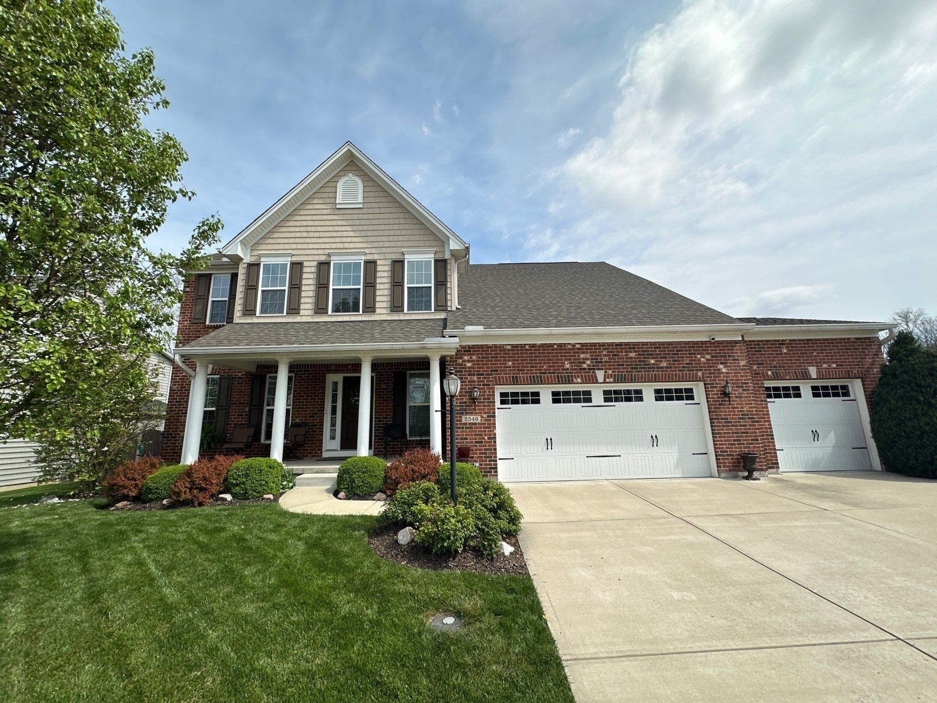 The two-story brick front with a three-car garage, Xenia, Ohio.