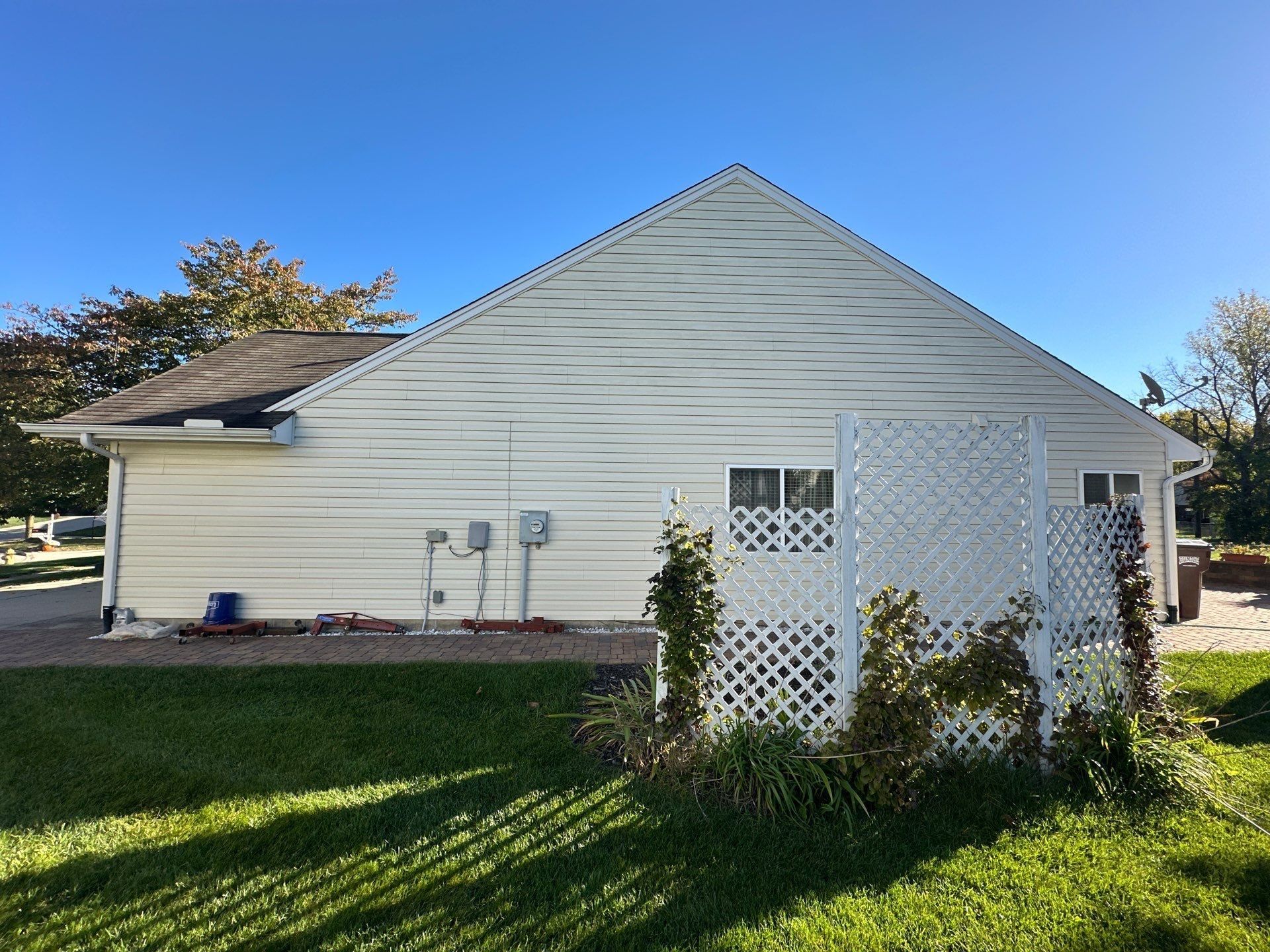 The side of the house with its white lattice trellis, under the old roof, Beavercreek, Ohio.