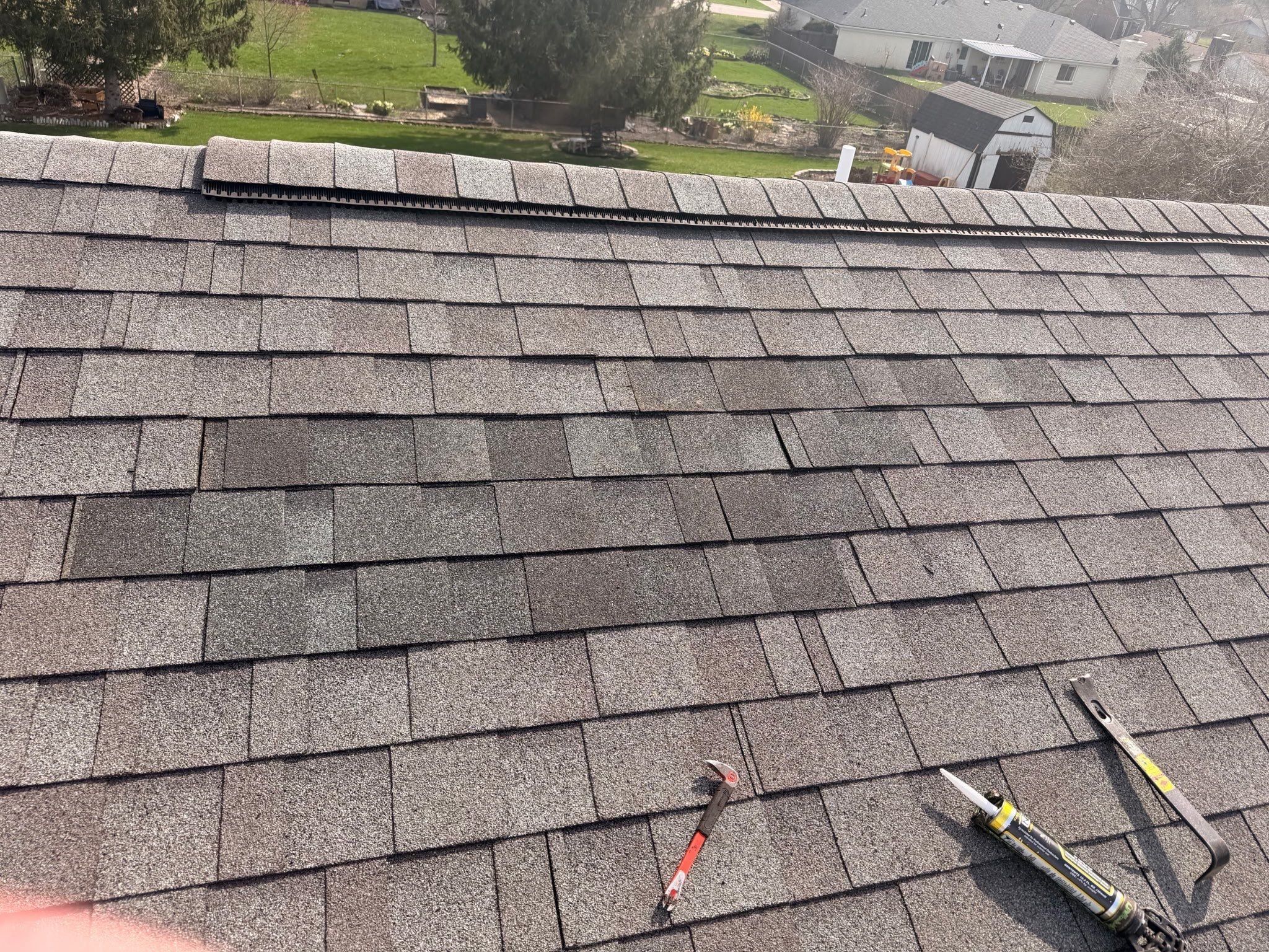 New shingles against the weathered roof