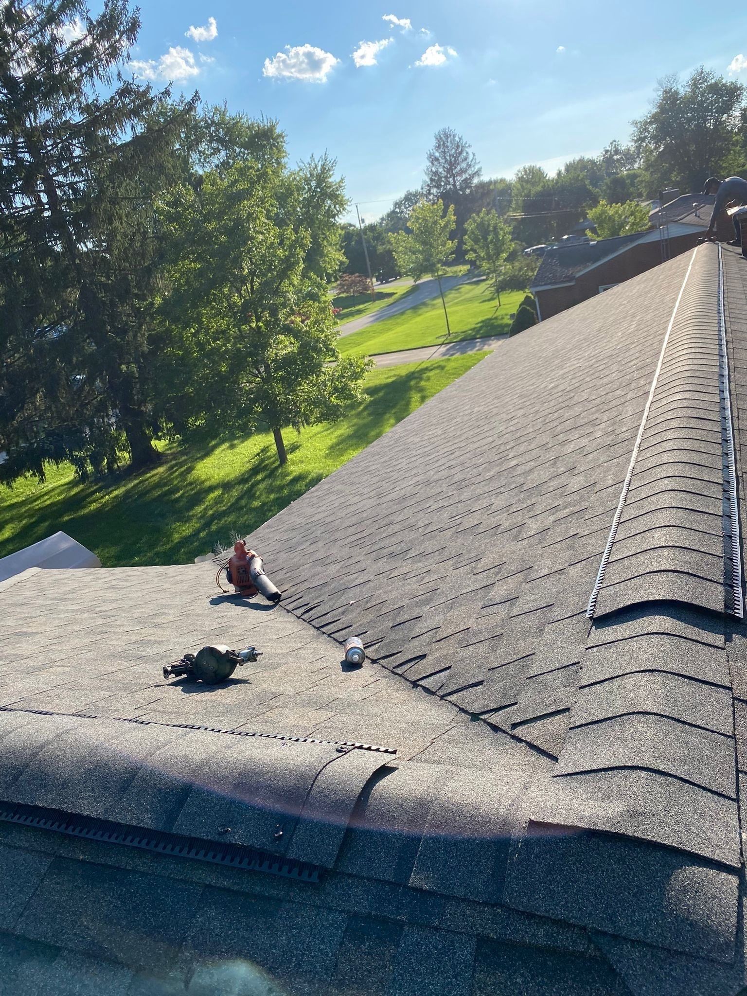 New ridge vent capped with shingles along the main roof peak, Beavercreek, Ohio.