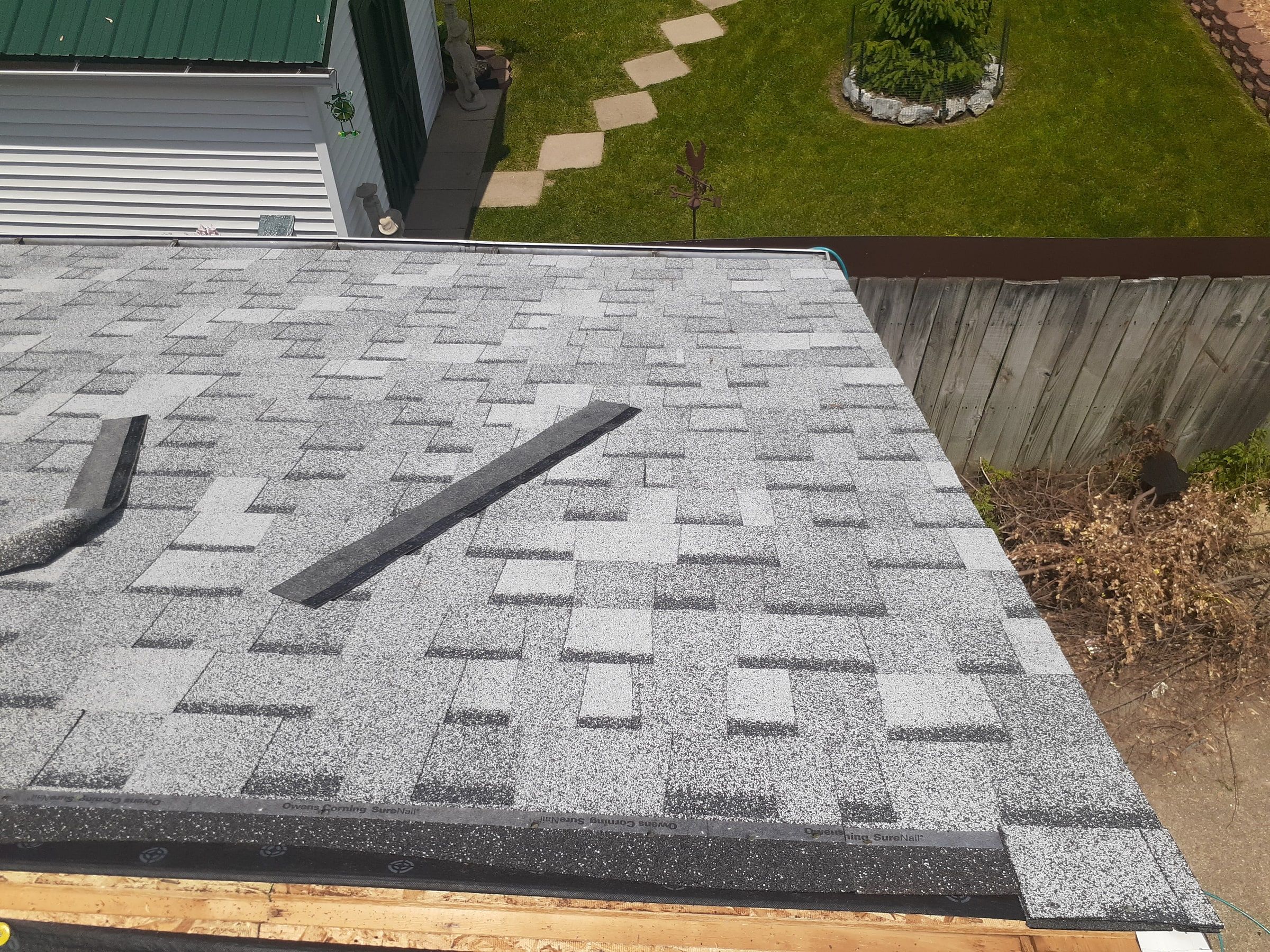 The starter row and first courses of new shingles at the eave, Huber Heights, Ohio.