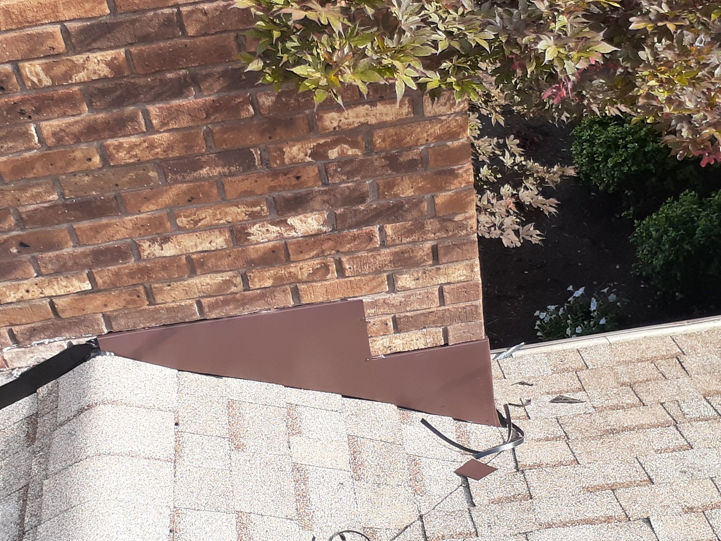 New metal step and counter flashing along the side of the chimney, Jamestown, Ohio.