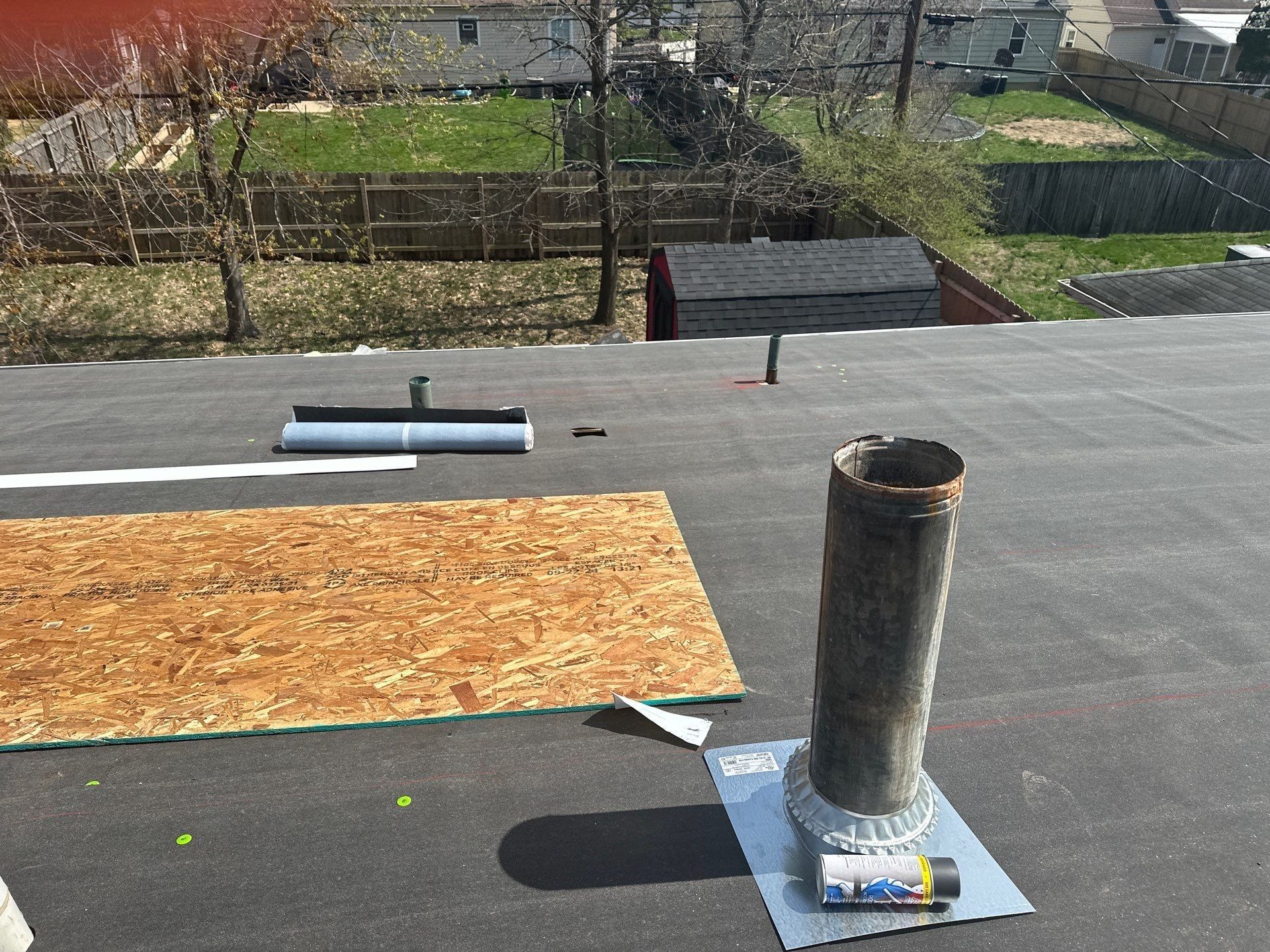 Ice and water shield around a flue pipe on the low-slope roof, Dayton, Ohio.